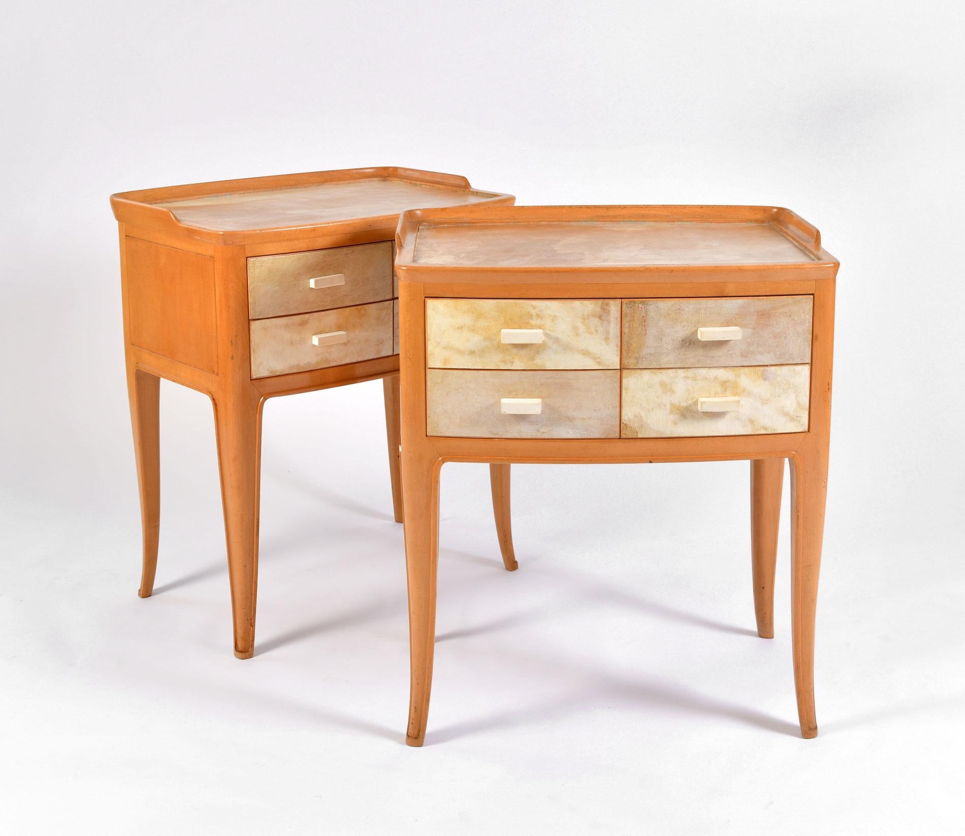 Elegantly carved pair of cherrywood bedsides with marbled parchment drawers and top. Each piece has four cream wood handles which open as two practical deep drawers. Slightly tapered legs.