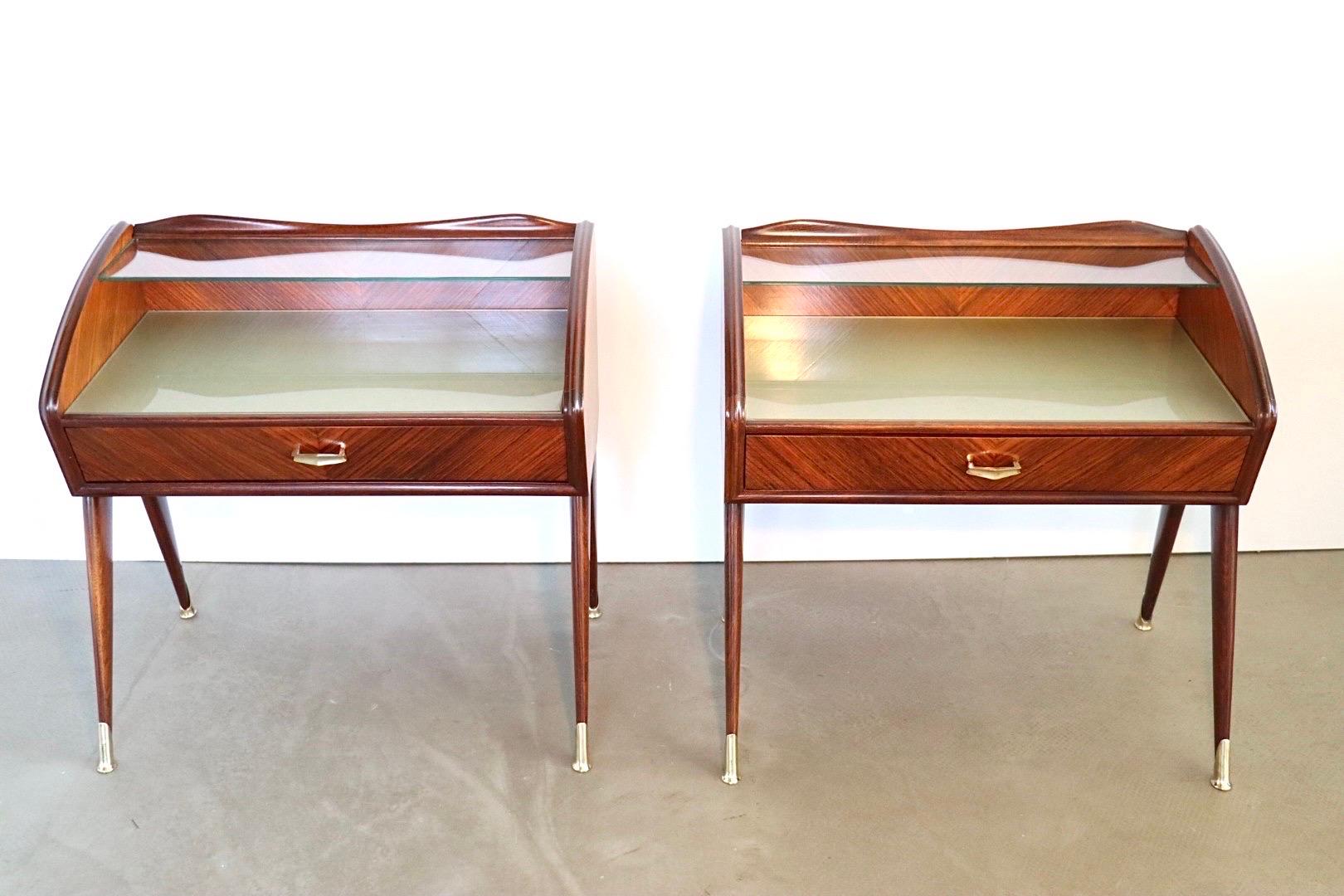 Remarkable and rare set of 2 night stands or bed side tables by Italian designer Paolo Buffa. The tables feature a floating glass shelf on top, a glass covered table top with a beautifully patterned green / silverish finish underneath the glass