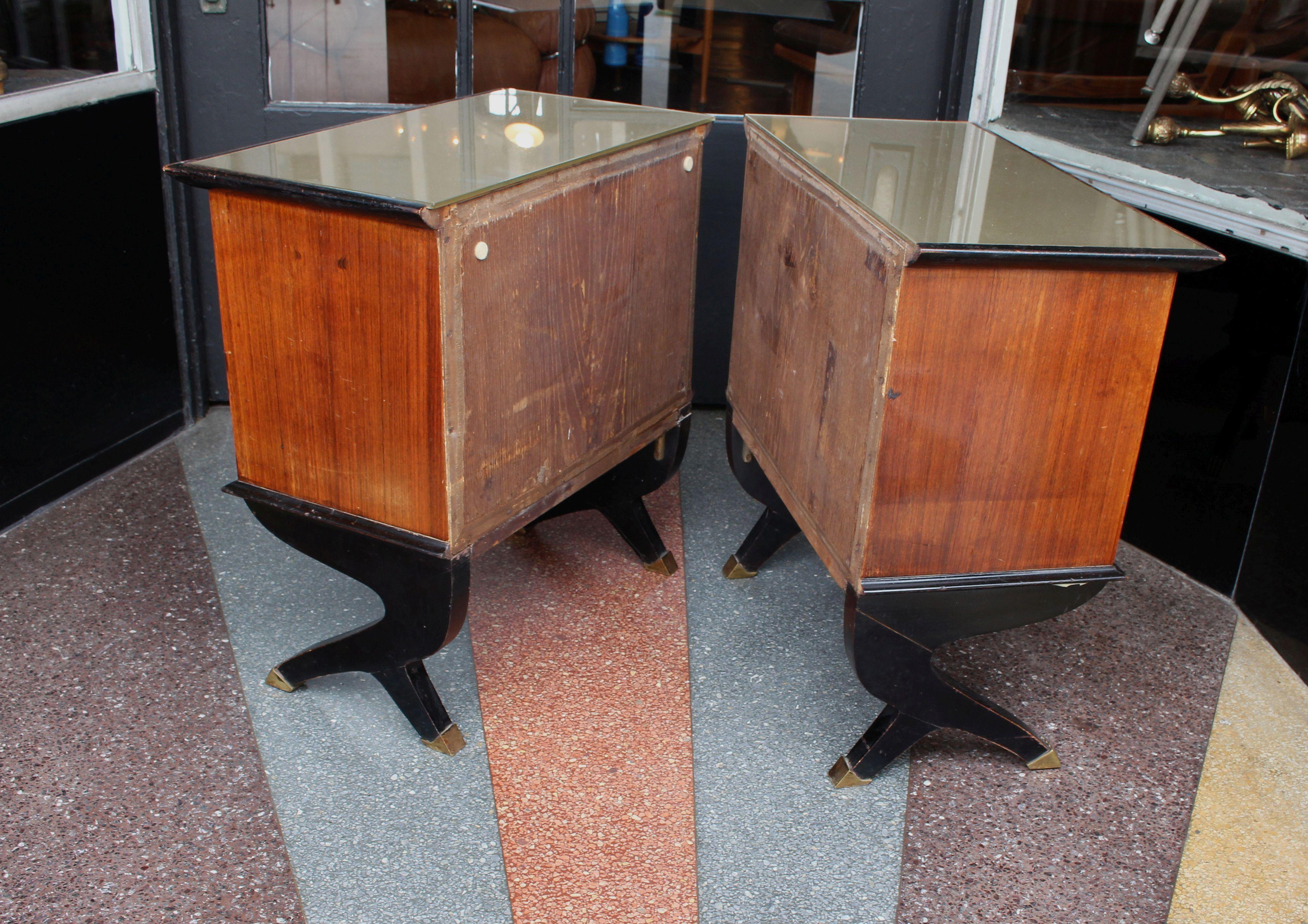 Italian pair of side tables, rosewood and the top is glass mirror. Bottom of the legs are the brass boots.
Side tables are in original condition as shown on the photos.
