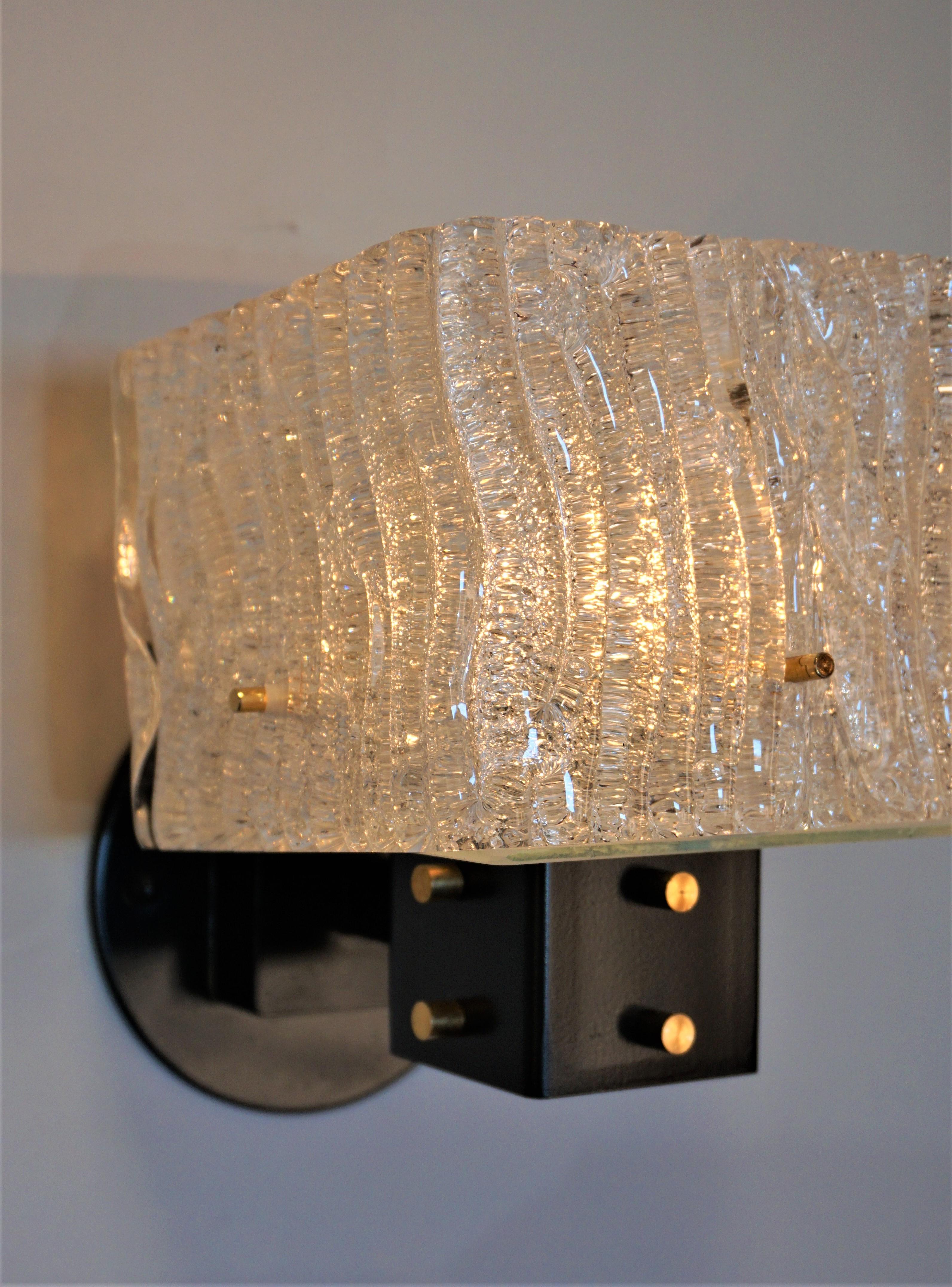 Pair of 1960's Italian texture hand blown glass and black lacquer frame wall sconces.
Matching chandelier Ref: LU913623196712.