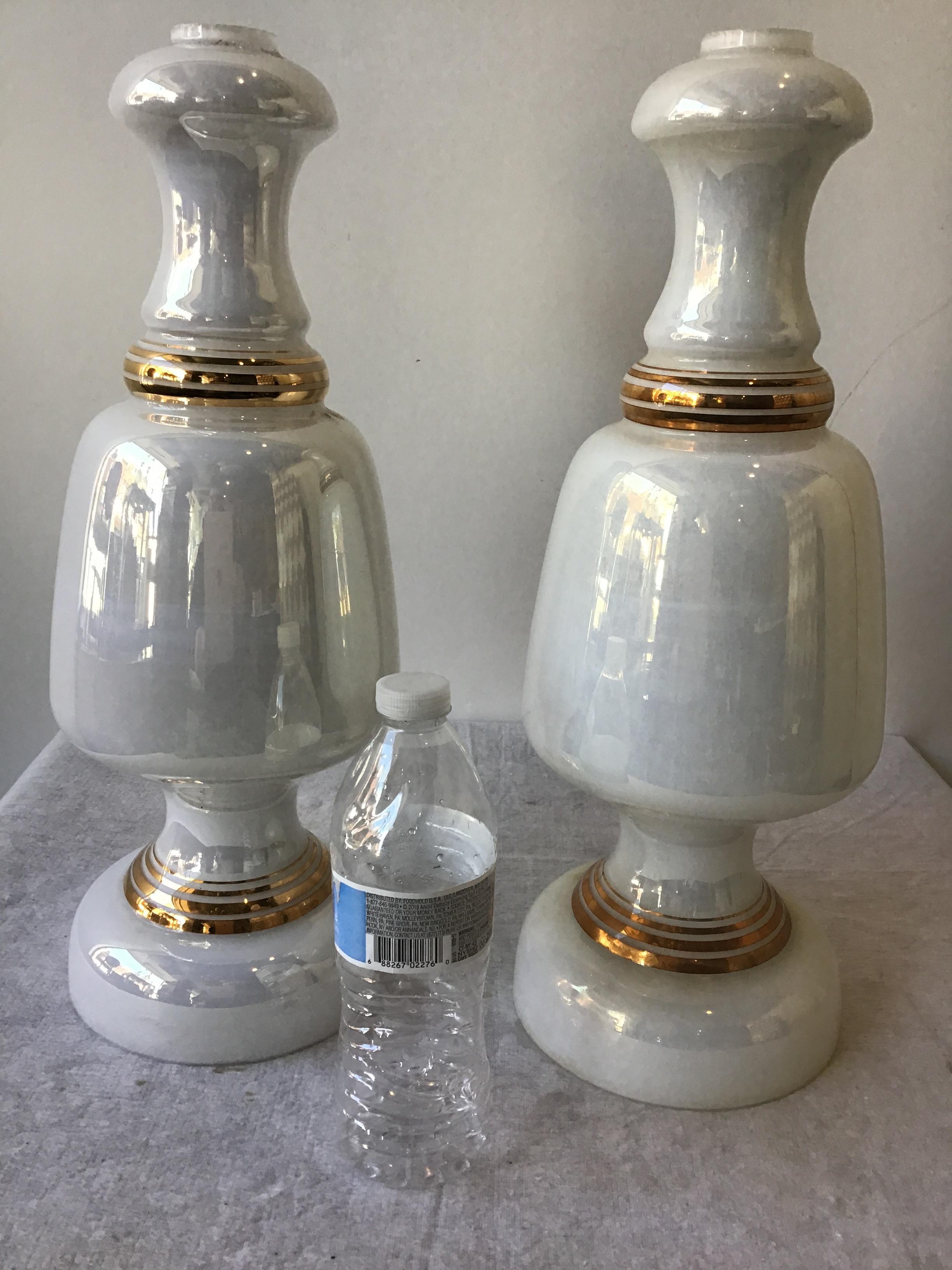 Pair of Italian 1960s white iridescent glass lamp bodies with gilt accents.
Lamps need all parts in order to be turned into functioning lights.