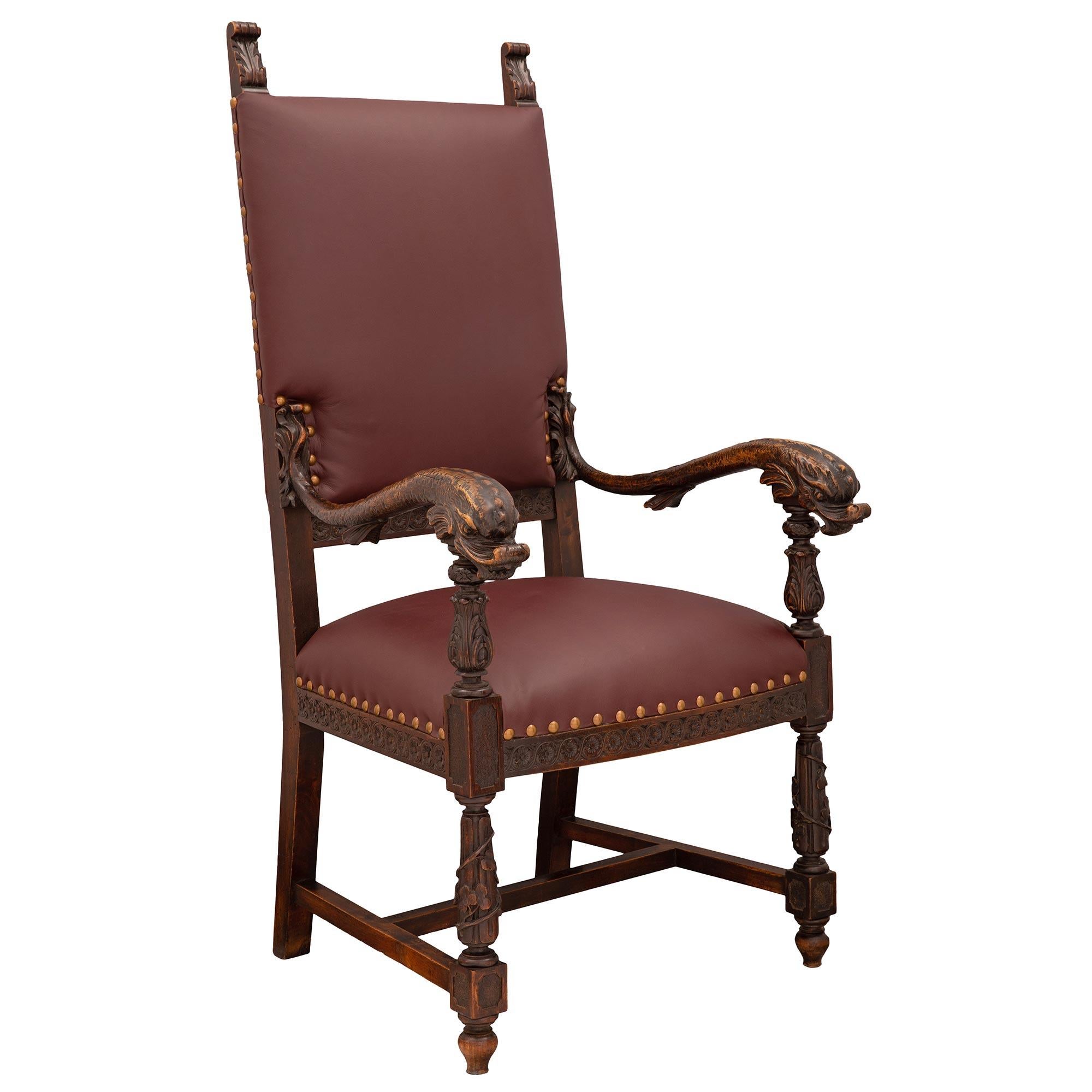 A most handsome pair of Italian mid-19th century Baroque st. dark oak and leather throne armchairs. Each chair is raised by elegant topie shaped feet below block reserves and unique inverted circular tapered fluted legs wrapped with a most