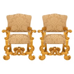 Antique Pair of Italian 19th century Baroque st. Giltwood armchairs.