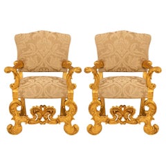 Pair of Italian 19th century Baroque st. Giltwood armchairs.