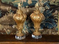 Pair of Italian 19th Century Carved Giltwood Fragments Made into Lamps on Lucite