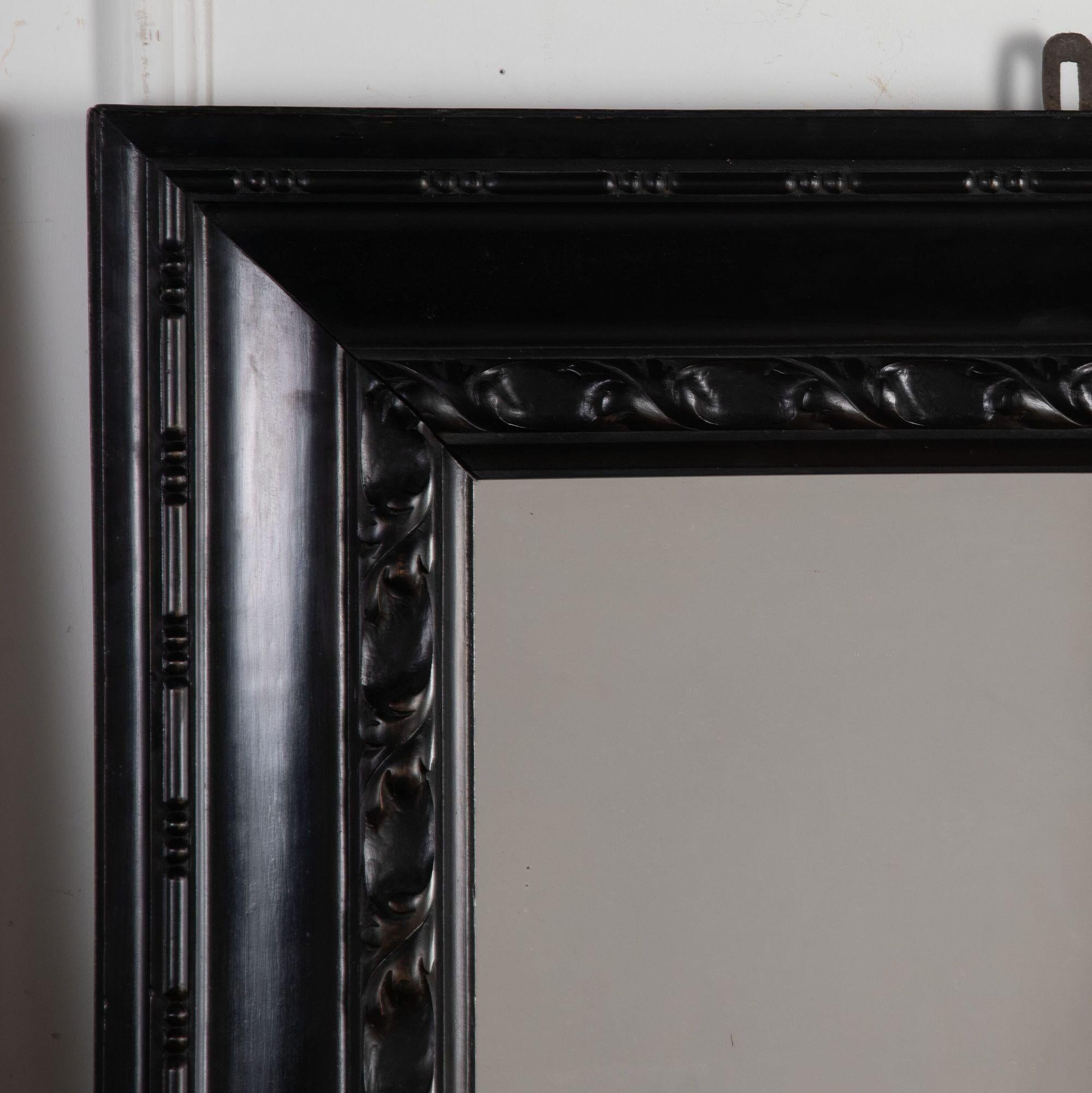 Pair of 19th century Italian mirrors with Ebonized wooden frames.
Beautifully and simply carved with a border of acanthus leaves and beading.