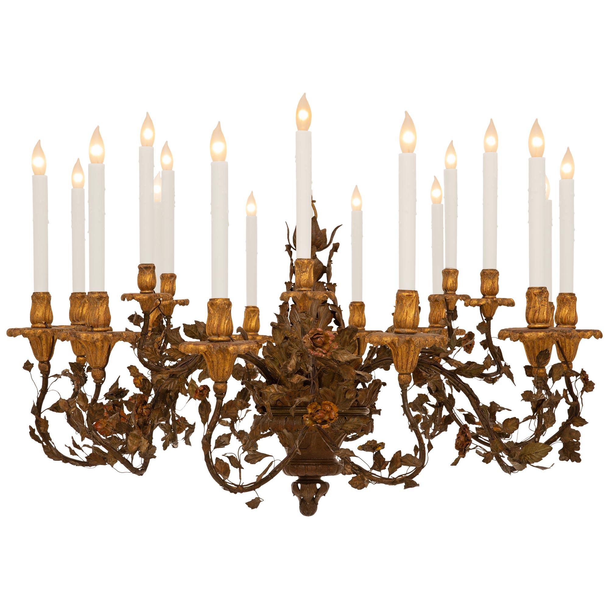 Baroque pair of Italian 19th century Iron, Tole, Giltwood, and Bronze chandeliers