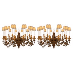 pair of Italian 19th century Iron, Tole, Giltwood, and Bronze chandeliers