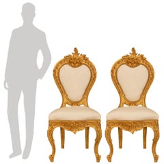 pair of Italian 19th century Louis XV st. Giltwood side chairs