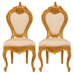 Antique pair of Italian 19th century Louis XV st. Giltwood side chairs