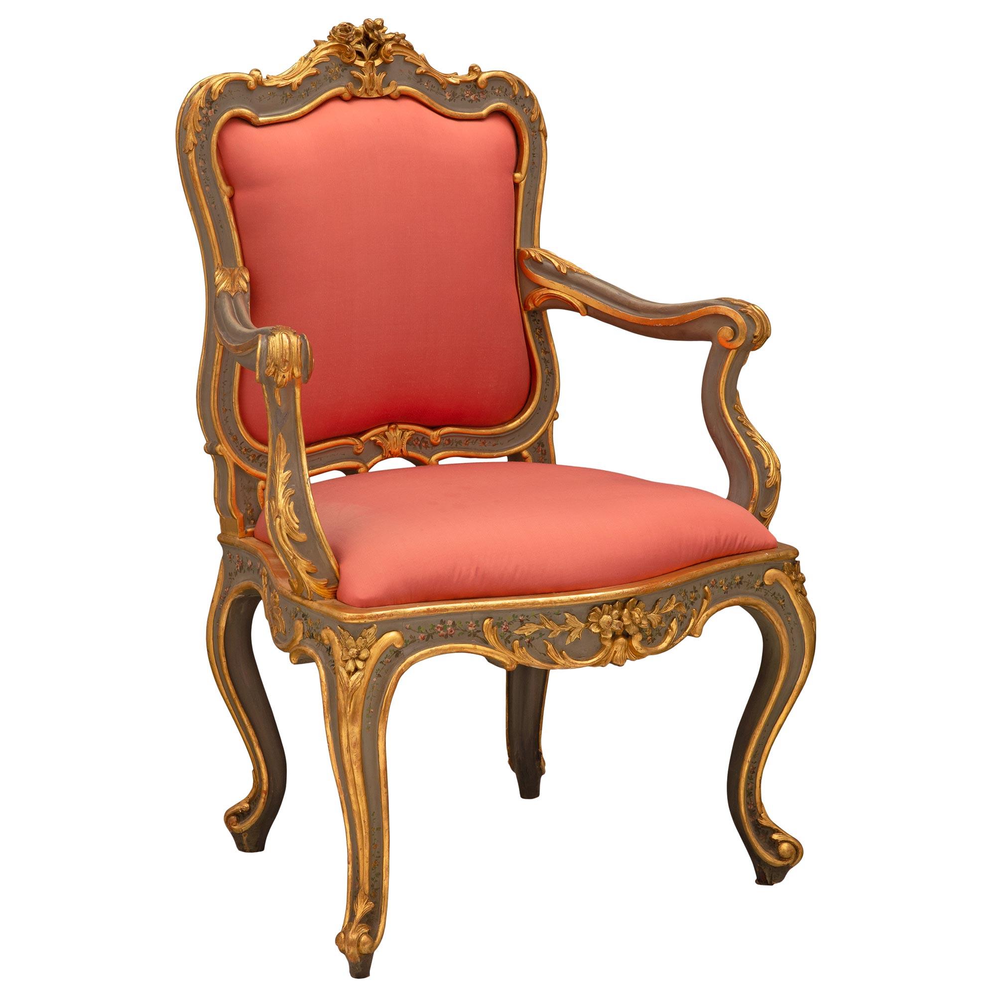 A striking and most decorative pair of Italian 19th century Louis XV st. patinated and giltwood armchairs. Each chair is raised by most elegant cabriole legs with fine scrolled feet and decorative giltwood filets which extend up each leg and along