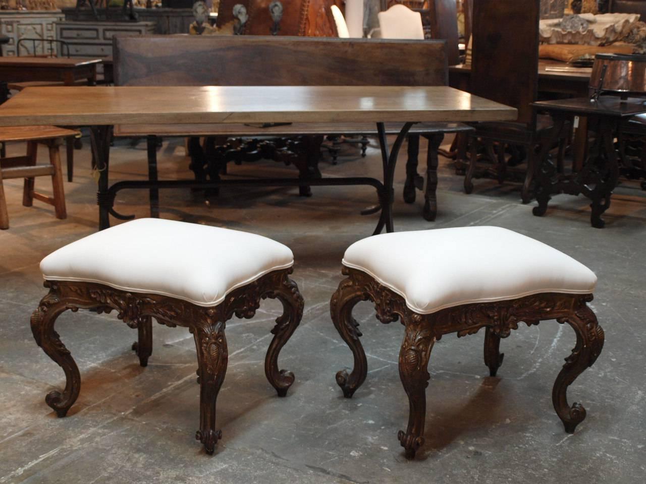 A stunning pair of late 19th century Italian Louis XV style stools in polychromed wood. Recently reupholstered.