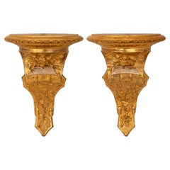 paire de consoles murales italiennes du 19e siècle de style Louis XVI en bois doré et méca