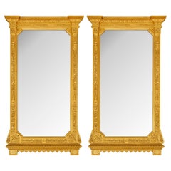 Paire de miroirs italiens du 19ème siècle en bois doré de style Louis XVI