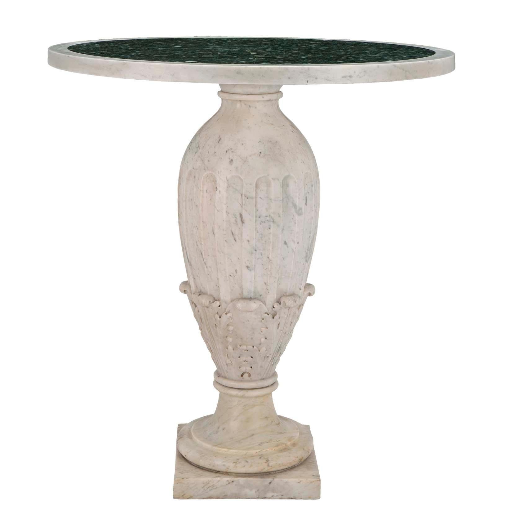 A striking pair of Italian 19th century Louis XVI St. marble tables. Each table is raised by a square white Carrara marble base below the mottled socle pedestal. The central baluster shaped support is decorated with richly carved large acanthus