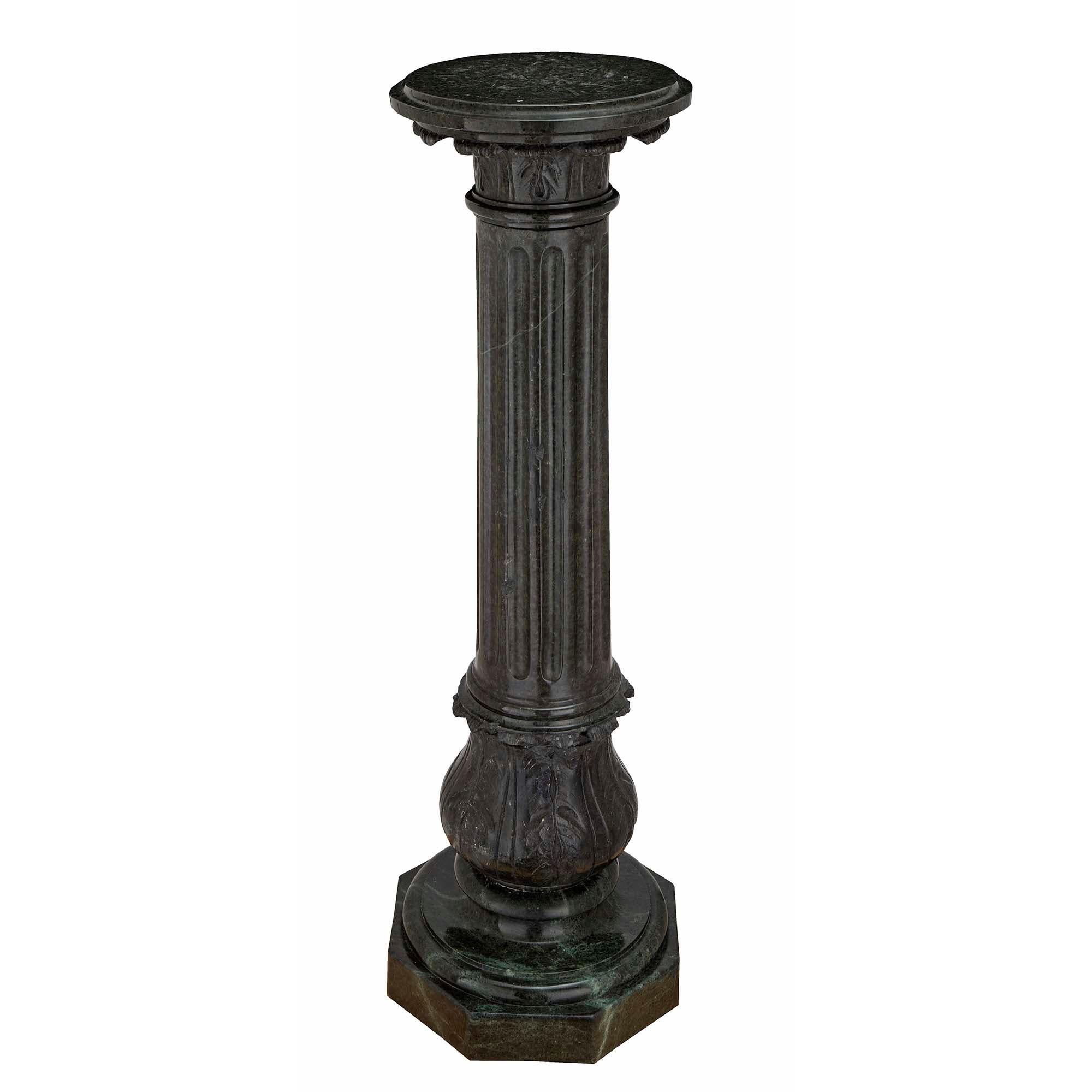 An elegant pair of Italian 19th century Louis XVI st. Verde Antico marble column pedestals. Each is raised by an octagonal base below a mottled circular design with richly carved acanthus leaves. The central column displays fluted patterns and