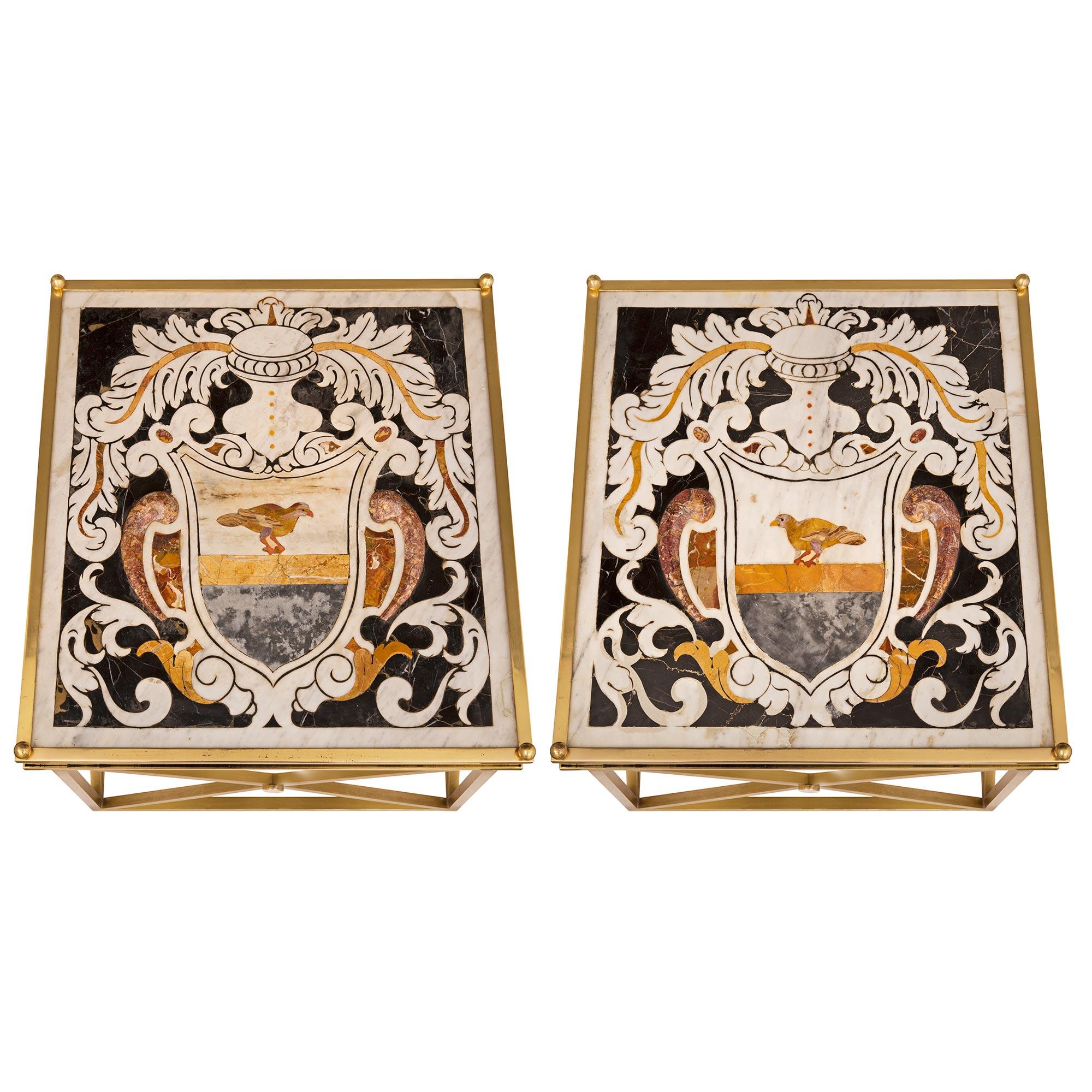 A sensational and extremely decorative true pair of Italian 19th century Pietra Dura marble plateaux set within beautiful 20th century brass bases mounted as side tables. Each table is raised by fine ball feet below the most elegant brass base with