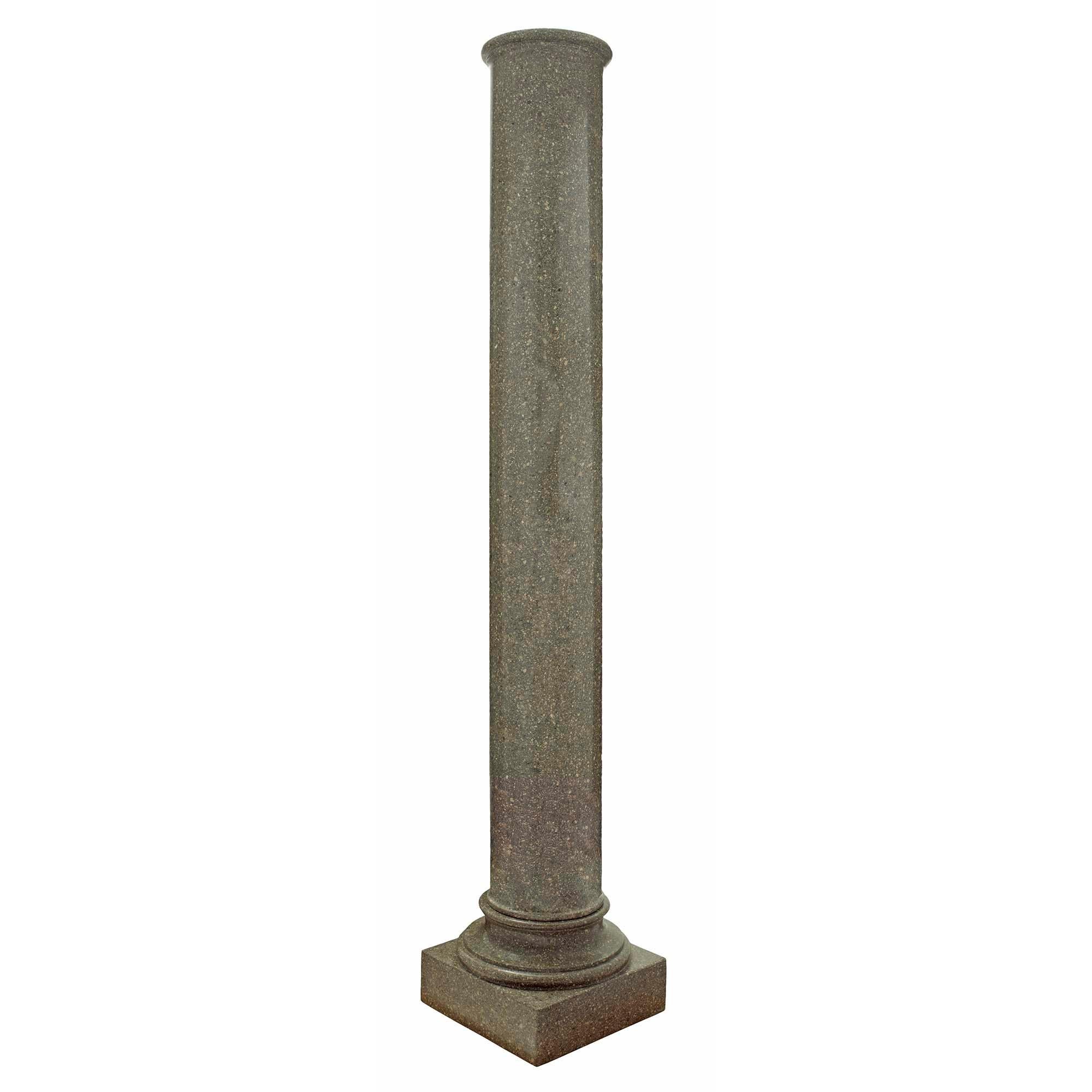 A monumental and elegant pair of Italian 19th century Neo-Classical st. granite columns. Each circular column is raised by a square base below a mottled socle pedestal. The columns display beautiful granite movement and a mottle lip at the top.

 