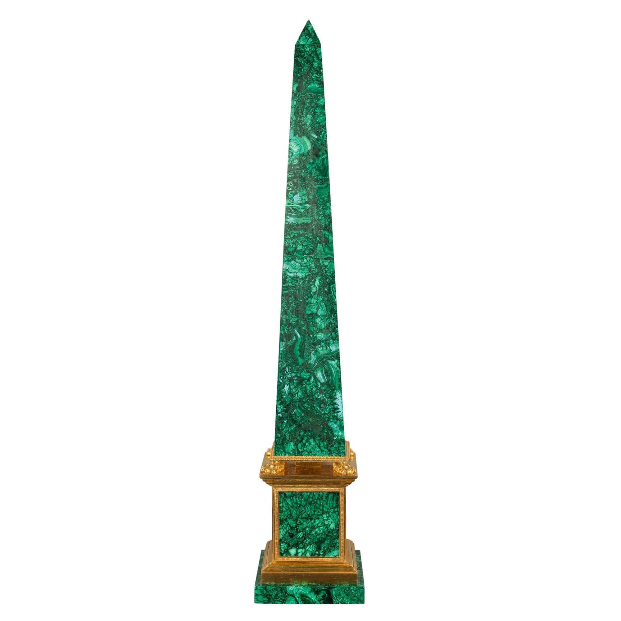 A most attractive and very high quality Italian 19th century Neo-Classical st. malachite and ormolu mounted obelisks. Each obelisk is raised by a square malachite base below the ormolu plinth with recessed malachite side panels. At the central