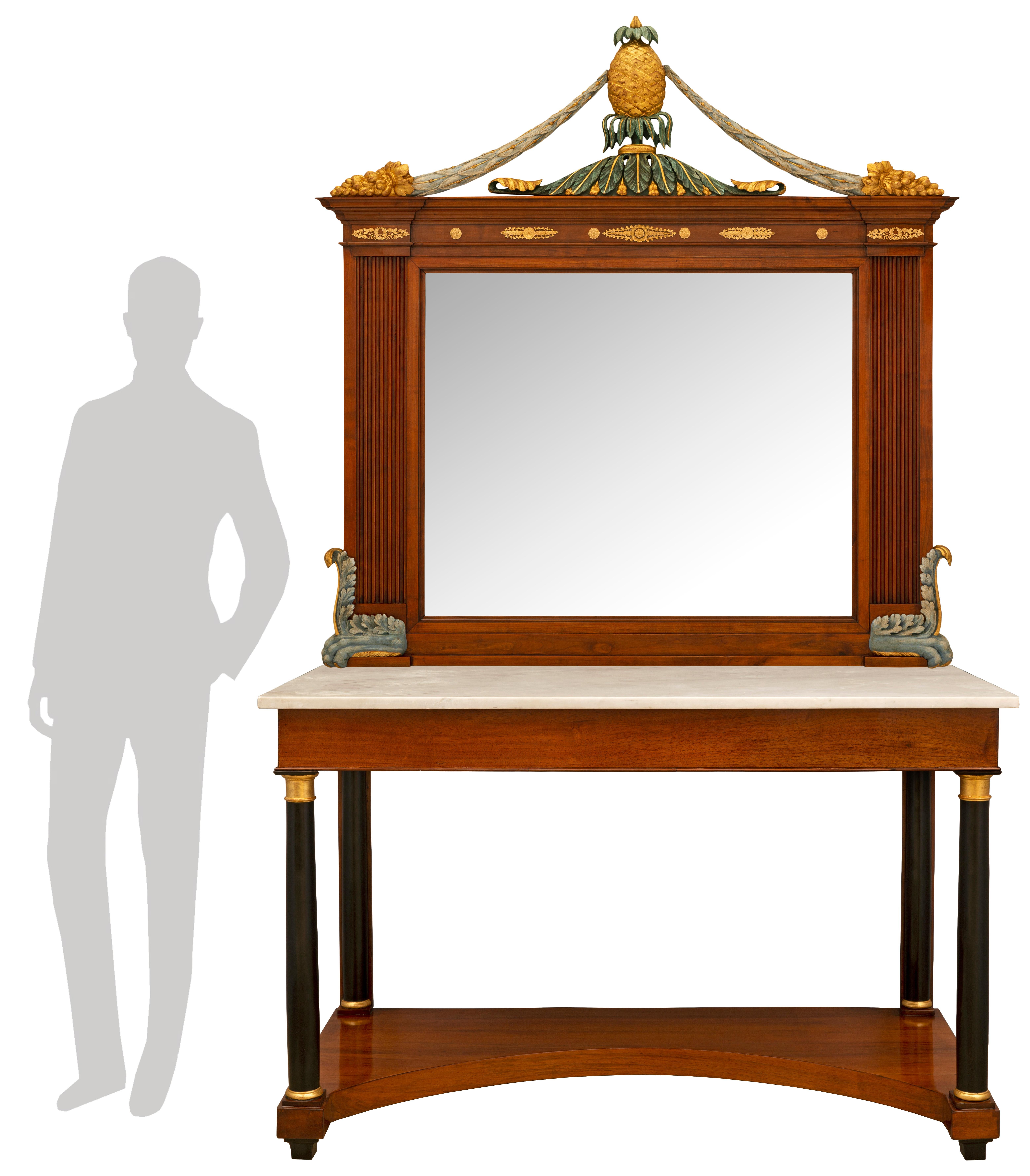 An impressive and most rare pair of Italian 19th century Neo-Classical st. Cherrywood, giltwood, polychrome, ebonized Fruitwood, ormolu matching mirrors and consoles. The consoles are raised by elegant square mottled supports below a most decorative