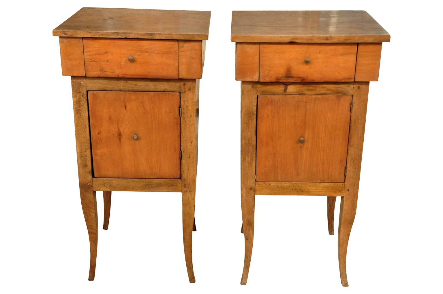 A sensational pair of later 19th century nightstands or side cabinets from the Veneto region of Italy. Handsomely constructed from fruitwood with a wonderful Minimalist form.