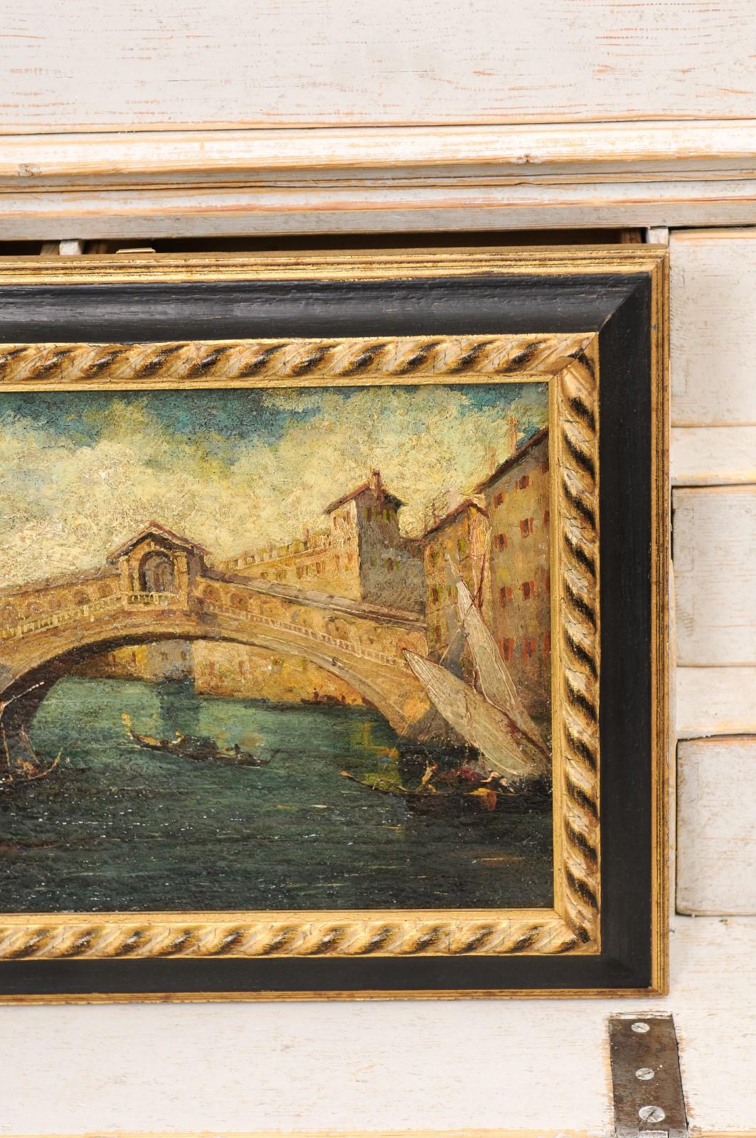 Paire de peintures italiennes du 19ème siècle représentant Venise dans des cadres noirs et or en vente 4