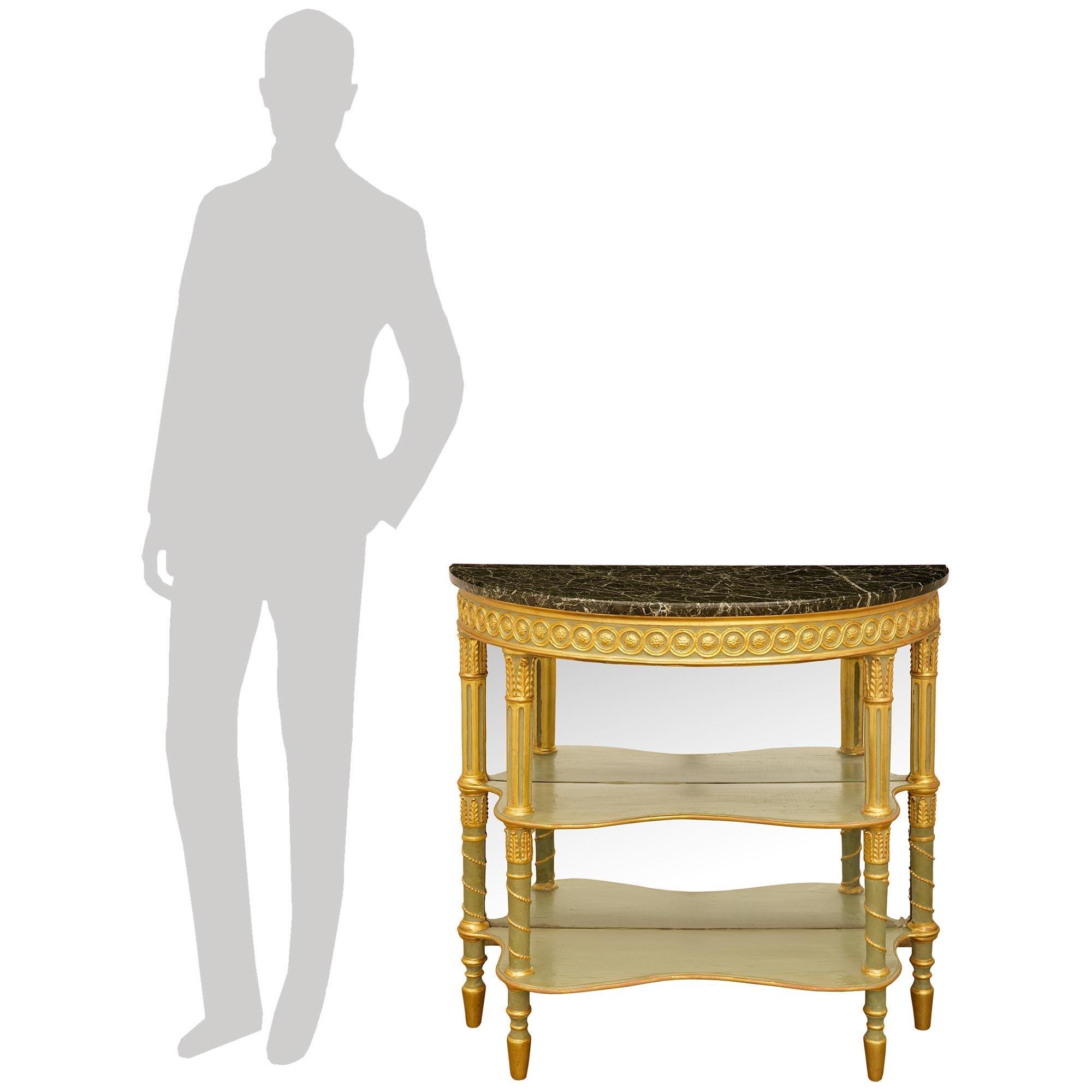 An elegant and most decorative pair of Italian early 19th century patinated Wood, Giltwood and Verde Alpi marble consoles. This wonderful pair of demi lune shaped mirrored consoles is raised by four patinated green columns with bottom toupie shaped