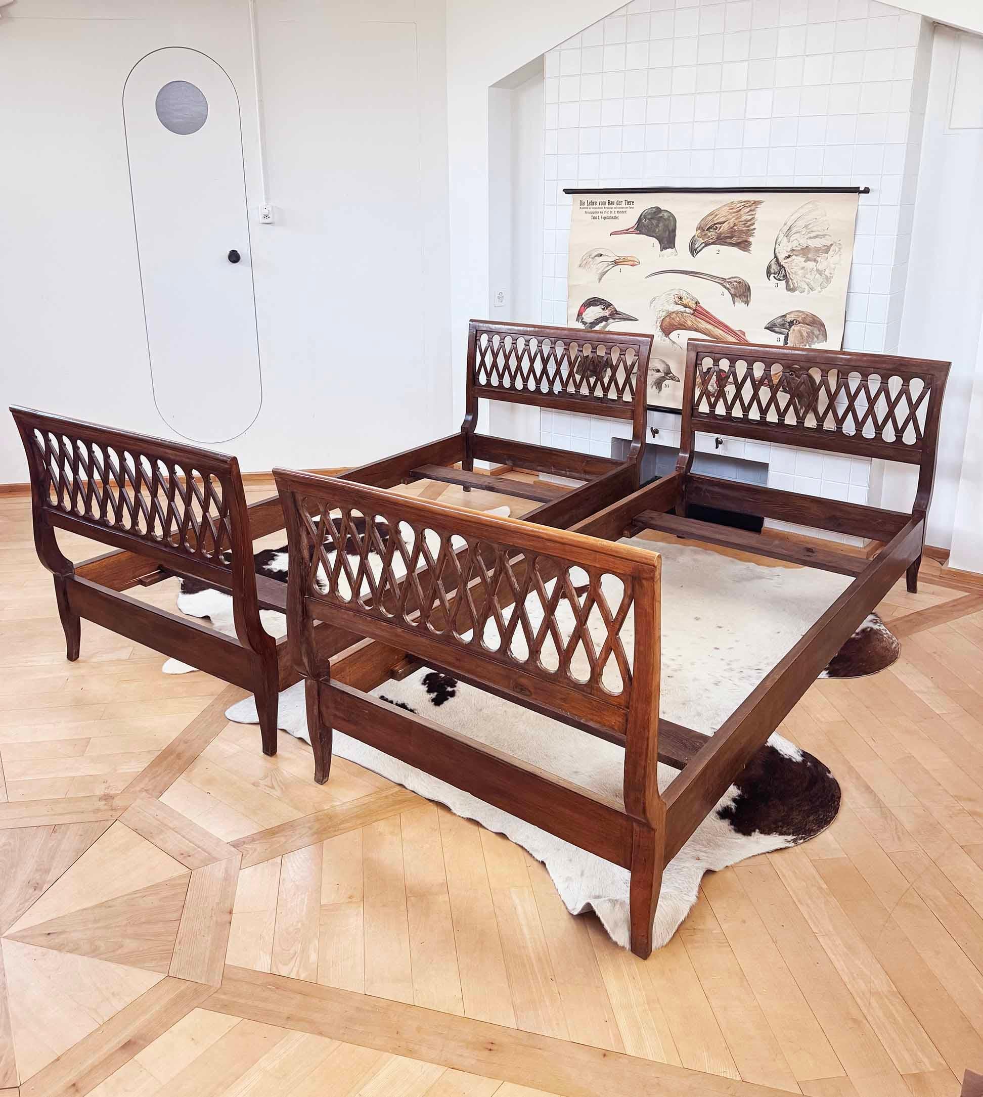 Stunning pair of twin sized vintage Italian bed frames in the style of Osvaldo Borsani.
Incredible carved infinity detailing here!

These could be installed together to create a King sized double bed, if pushed together. They are as well beautiful