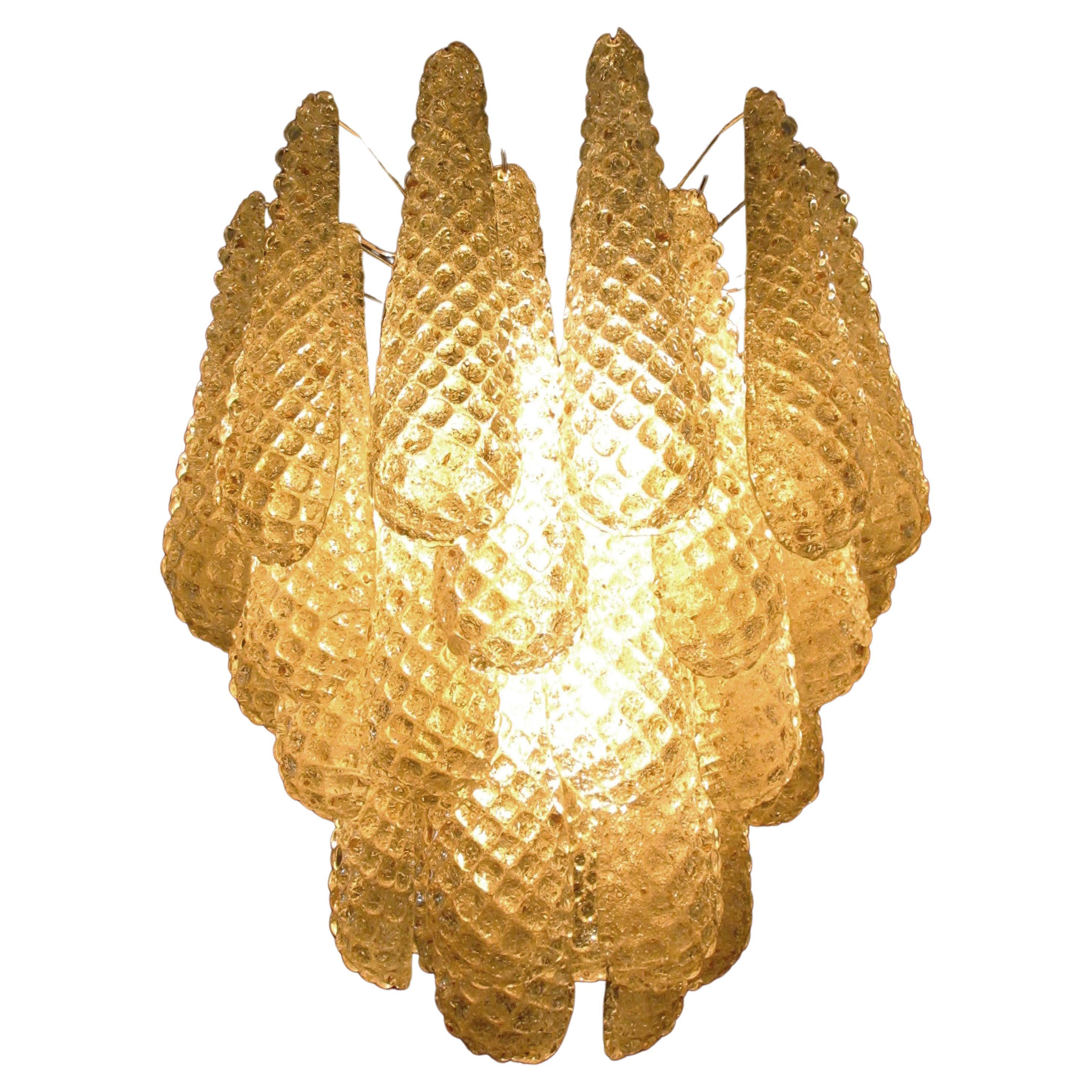 Pair of Italian vintage Murano chandeliers made by 41 glass petals (amber crystal, smooth outside, with crystal transparent and amber powder and then rough inside.) in a chrome frame.
Period: Late 20th century
Dimensions: 49.20 inches (125 cm)