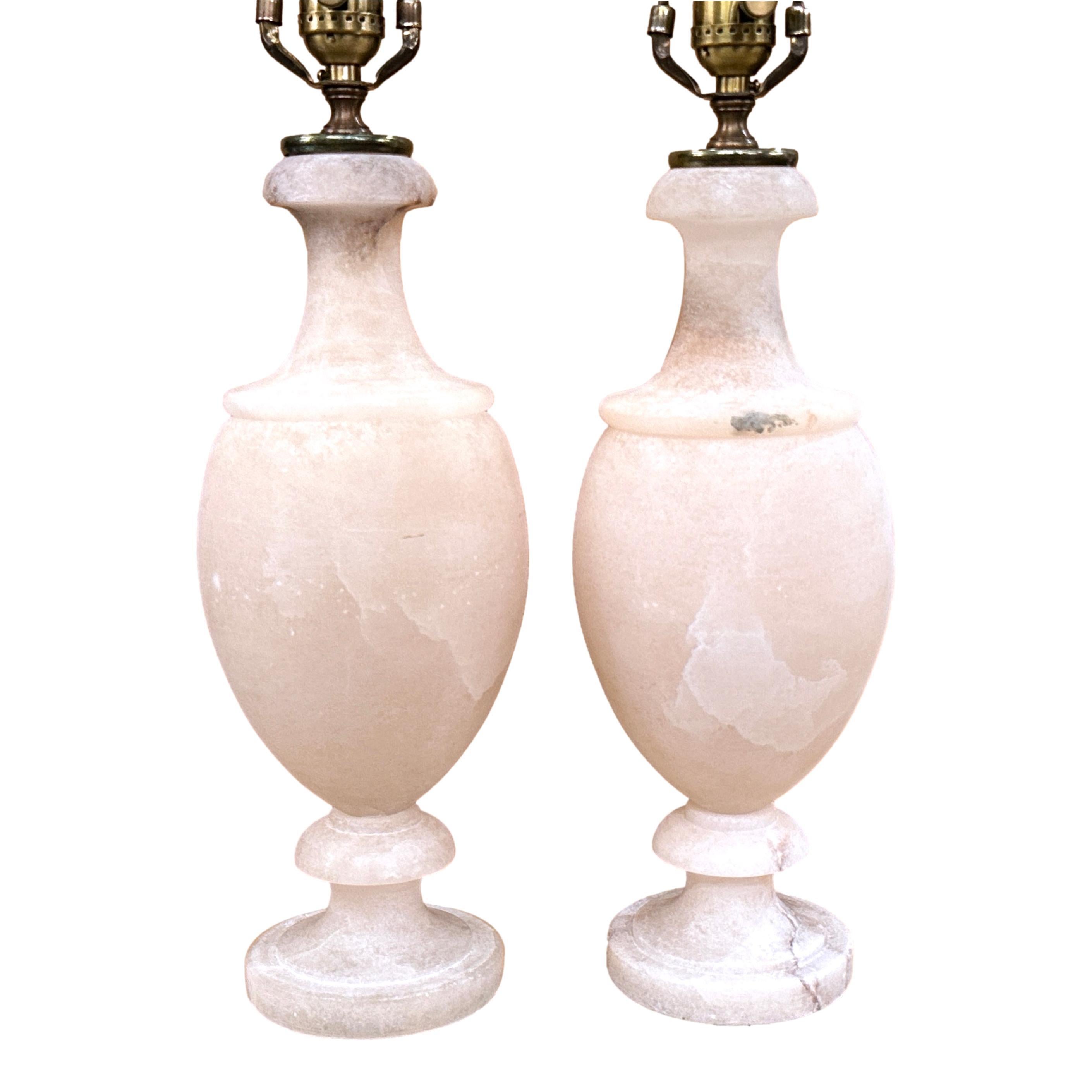 Pair of circa 1960's neoclassic Italian carved alabaster lamps.

Measurements:
Height of body: 15