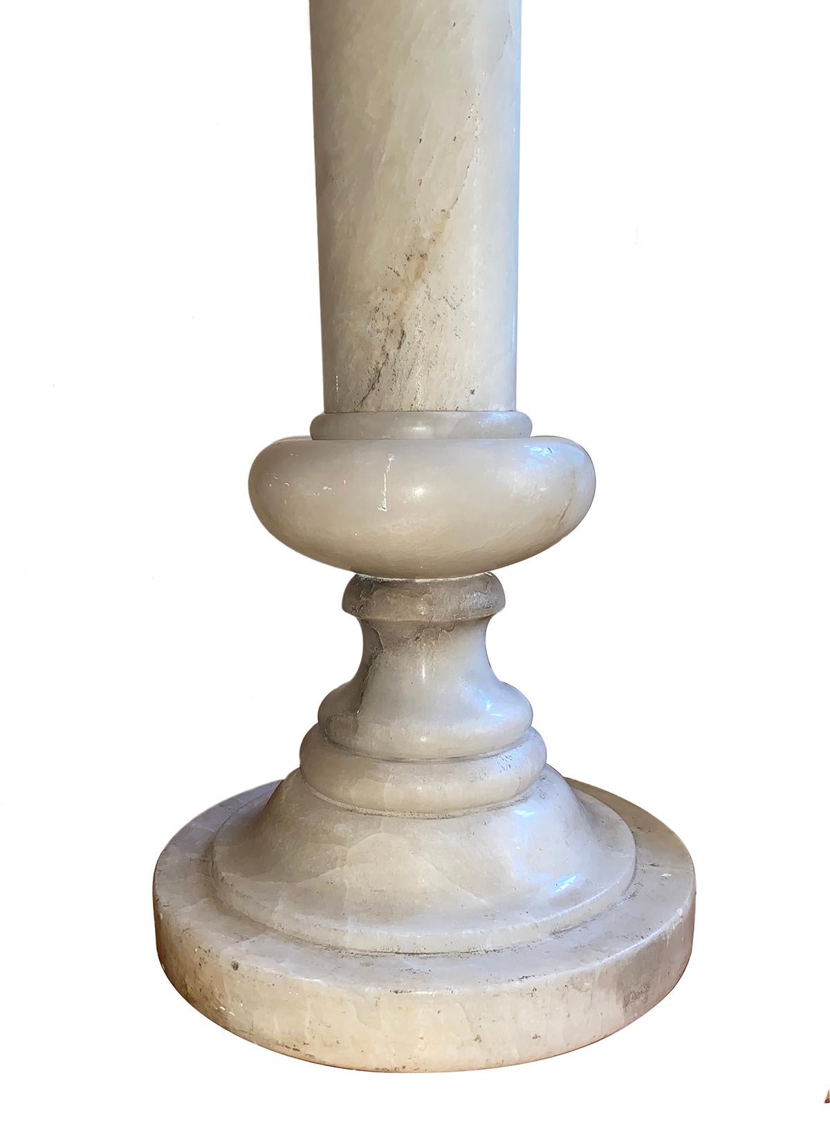 A pair of circa 1920s of Italian carved alabaster pedestals. Sold as pair.

Measurements:
Height: 41