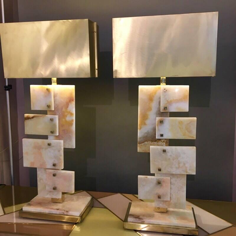 Pair of Italian alabaster table lamps, rectangular brass lampshades, brass fittings.