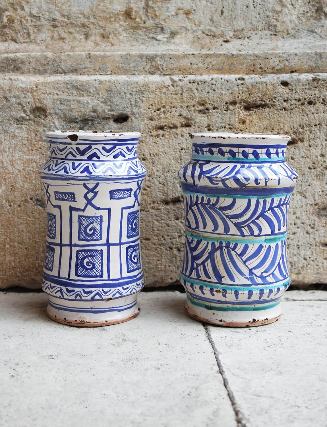 A beautiful and rare pair of maiolica patterned Italian albarelli, late 1800s early 1900s. Found in Palazzo Torlogna in Rome.  Alberelli were ancient storage containers often used in old pharmacies and shops. Their unique shape was designed to fit