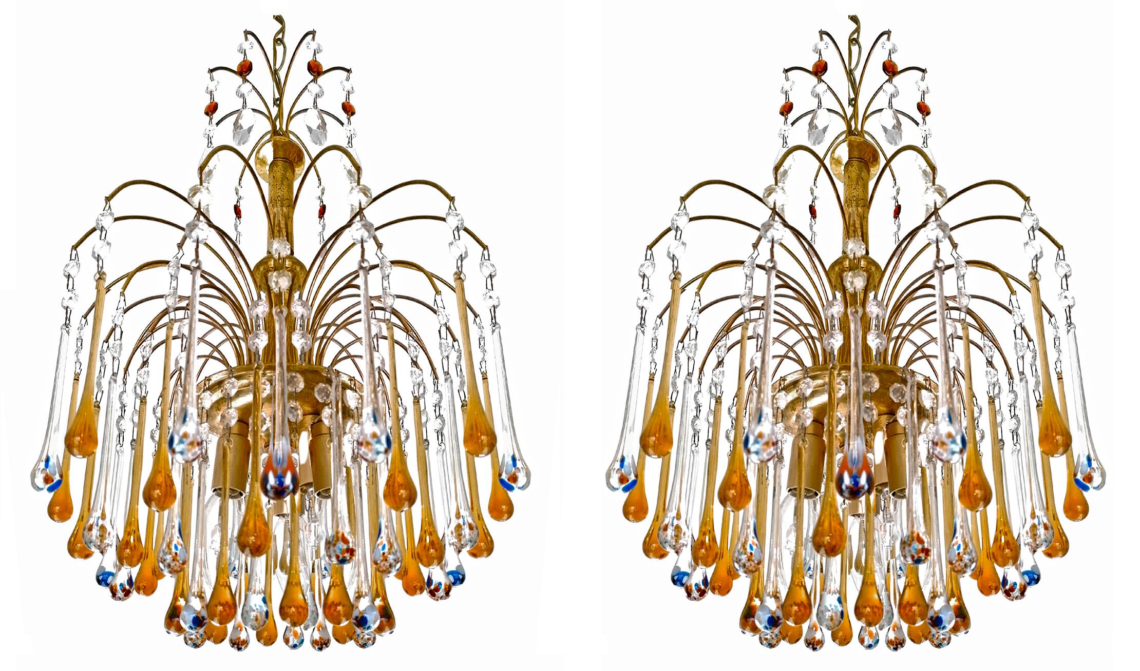 Lovely pair of Italian waterfall Chandeliers in style of Venini. In gilt brass and Amber & Polychrome Murano hand blown Crystal Teardrop glasses making a gorgeous sparking lighting effect!
Age patina.

Dimensions:
Height: 35.44 in.(chain = 10