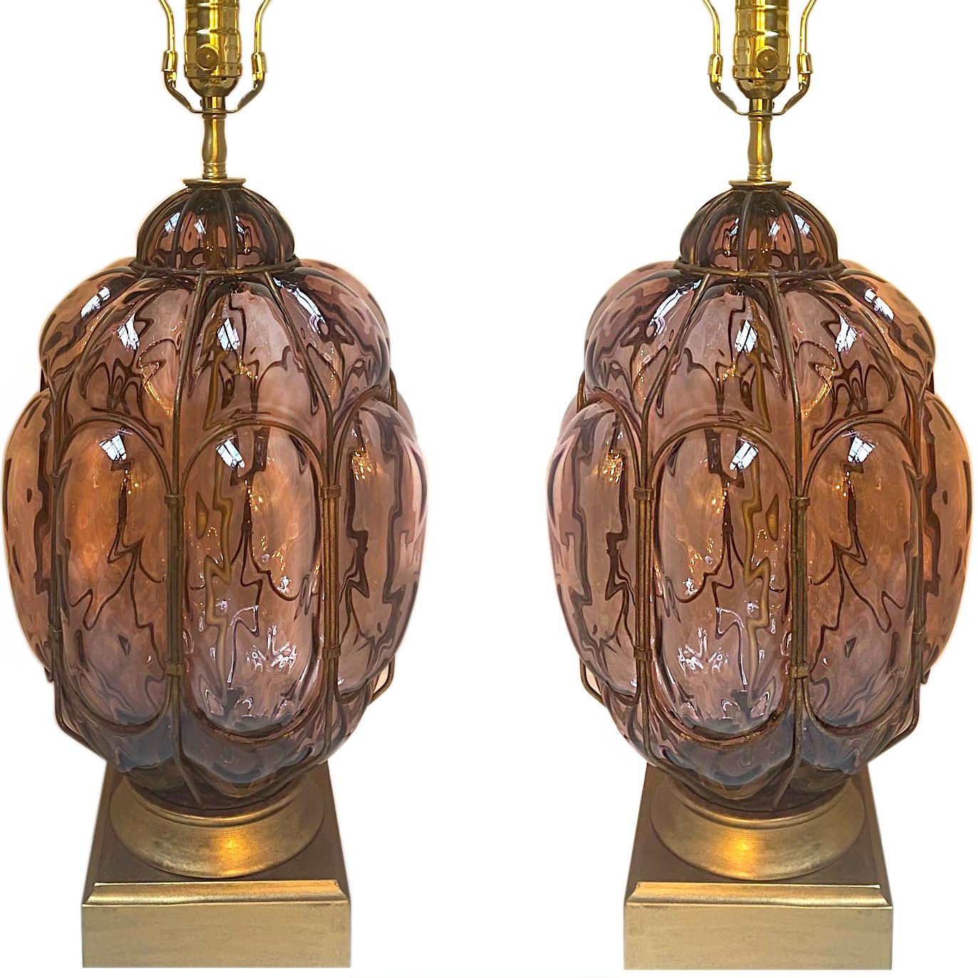 A pair of circa 1940's blown Murano glass table lamps with gilt bases.

Measurements:
Height of body: 18.5