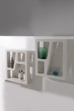 Pair of Italian anthropomorphic hanging bookcases in the style of Gio Ponti