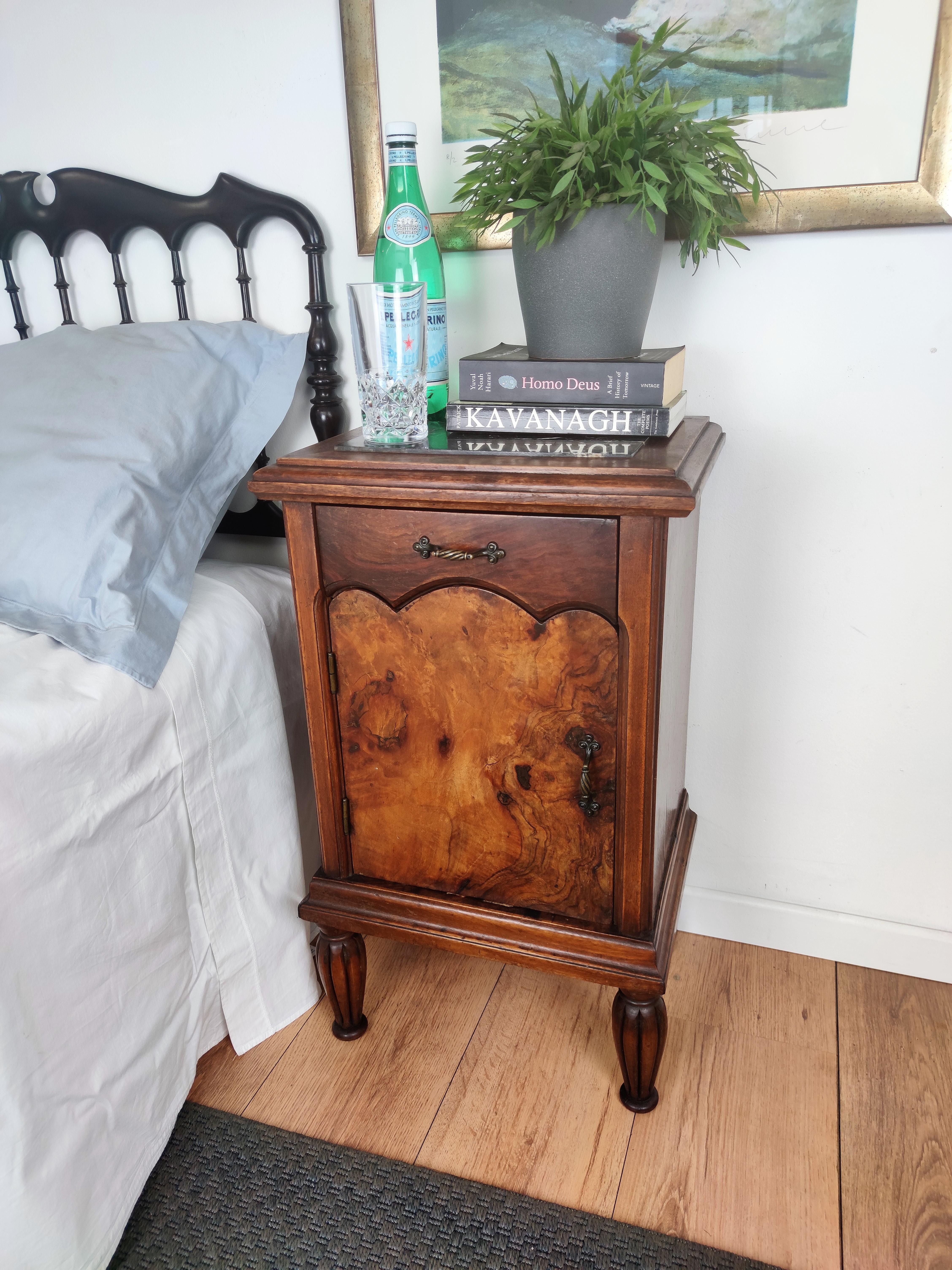 Pair of lovely antique Italian night stands or side tables with greatly carved doors and drawers and Portoro marble top. Portoro is a high-quality black marble, where the vast crystalline black of its base is furrowed by a spectacular burst of