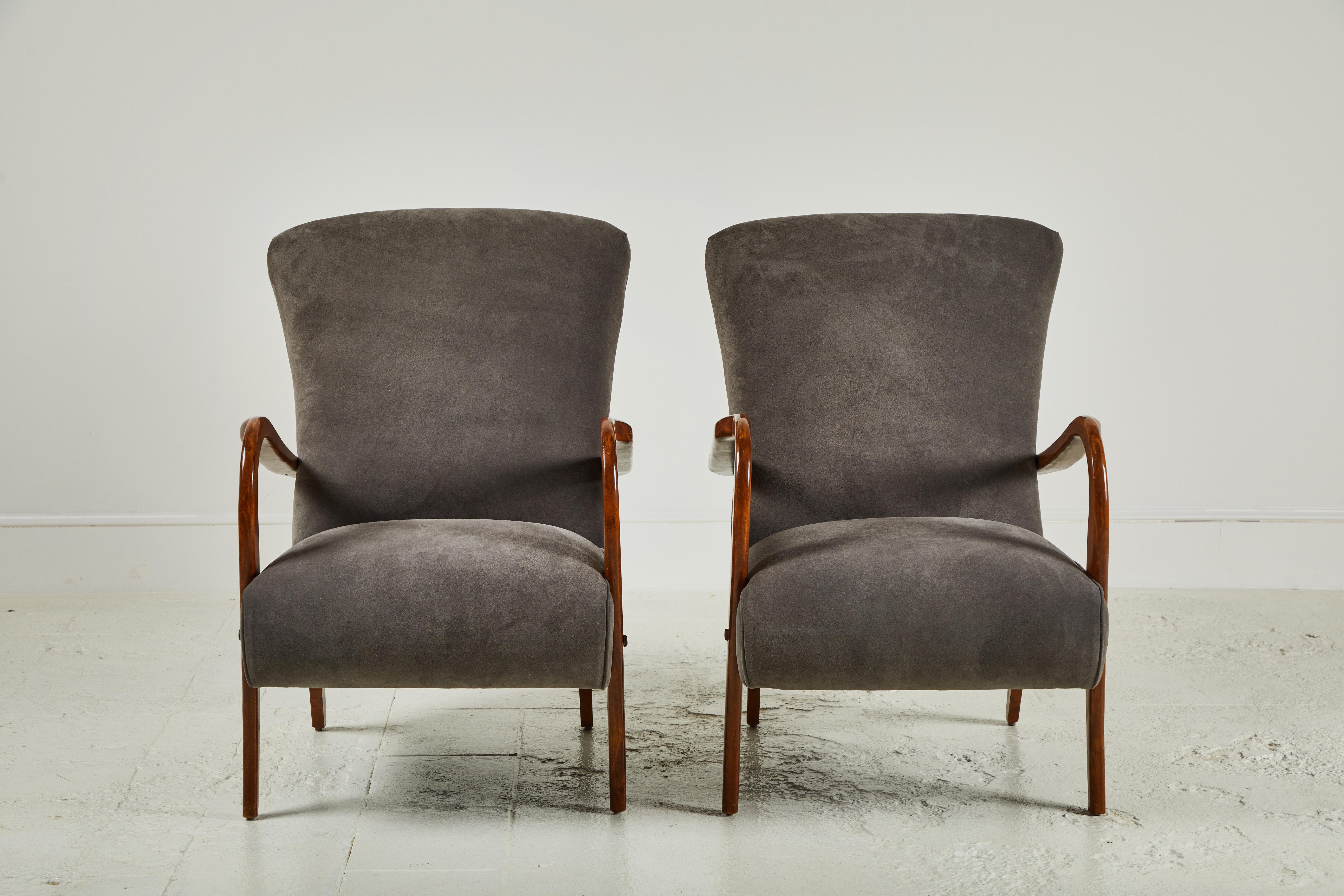 Pair of vintage Italian armchairs upholstered in grey suede. The wood finish is original, the chairs offer a modern and elegant silhouette.