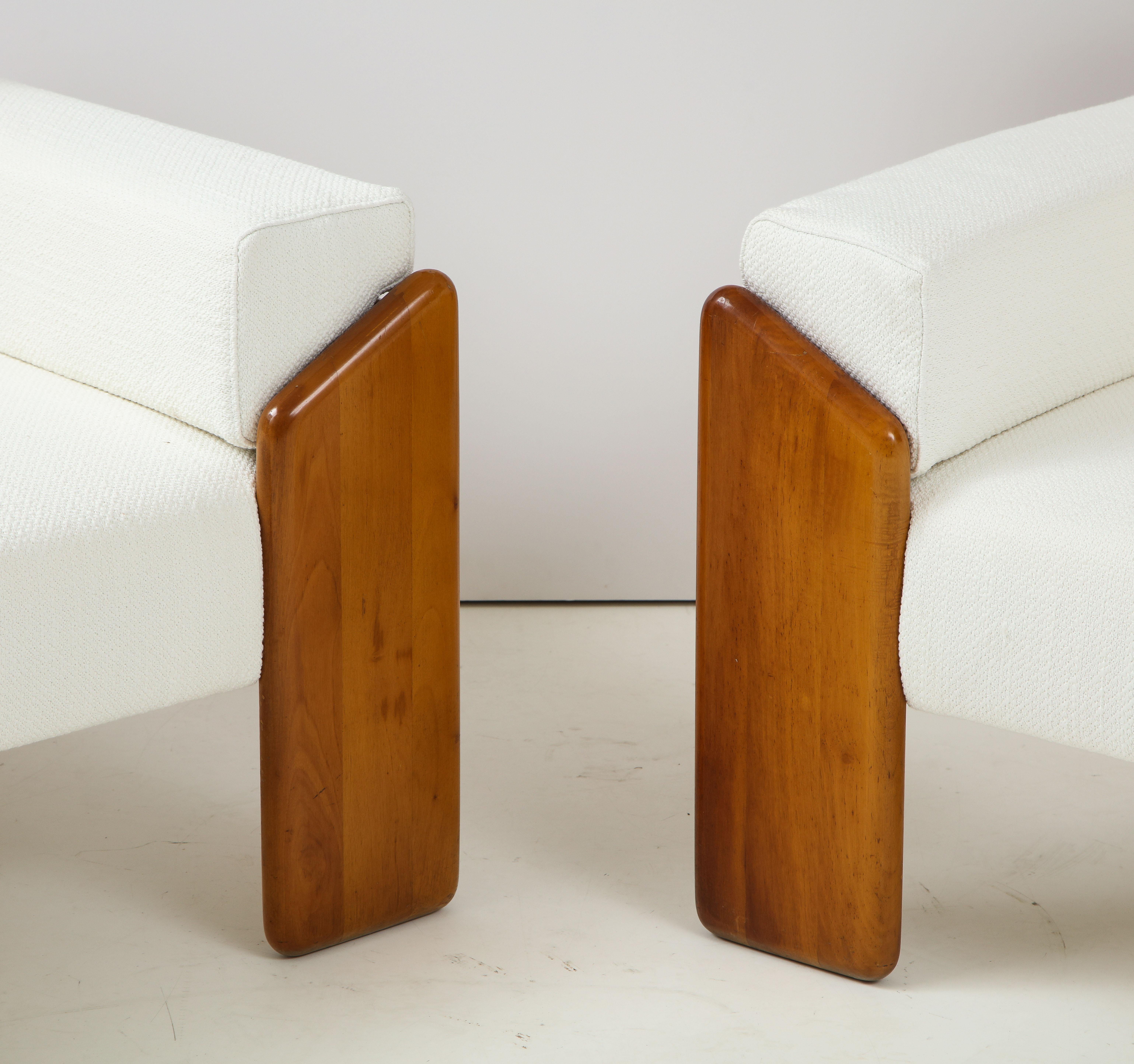 A pair of walnut armchairs by Sapporo for Mobil Girgi, made in the 1970's, Italy. Stamped. Beautifully designed with angled front legs which extend to the sides and back of the chairs, the back support is slightly curved. The flat upholstered arms