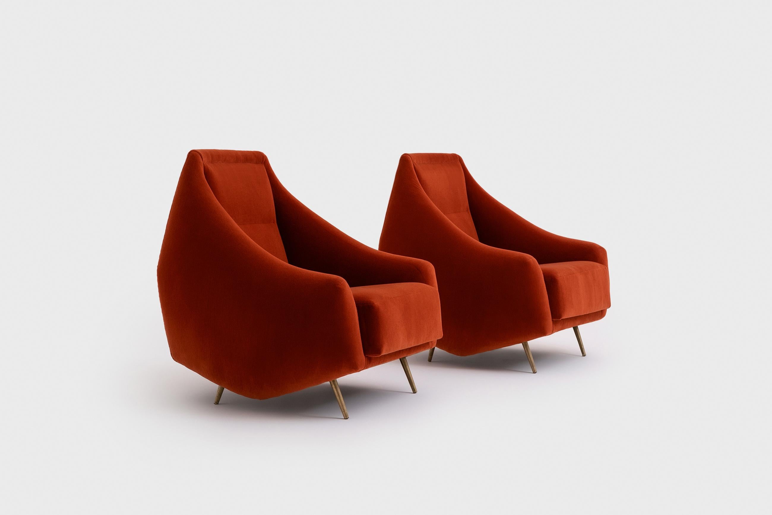 Rare pair of armchairs by Guglielmo Veronesi, Italy 1950s. Exceptional curved shape with nice distinctive sharp tapered brass legs. The chairs are fully reconditioned and are upholstered in a high quality brick red Mohair velvet by Dedar.