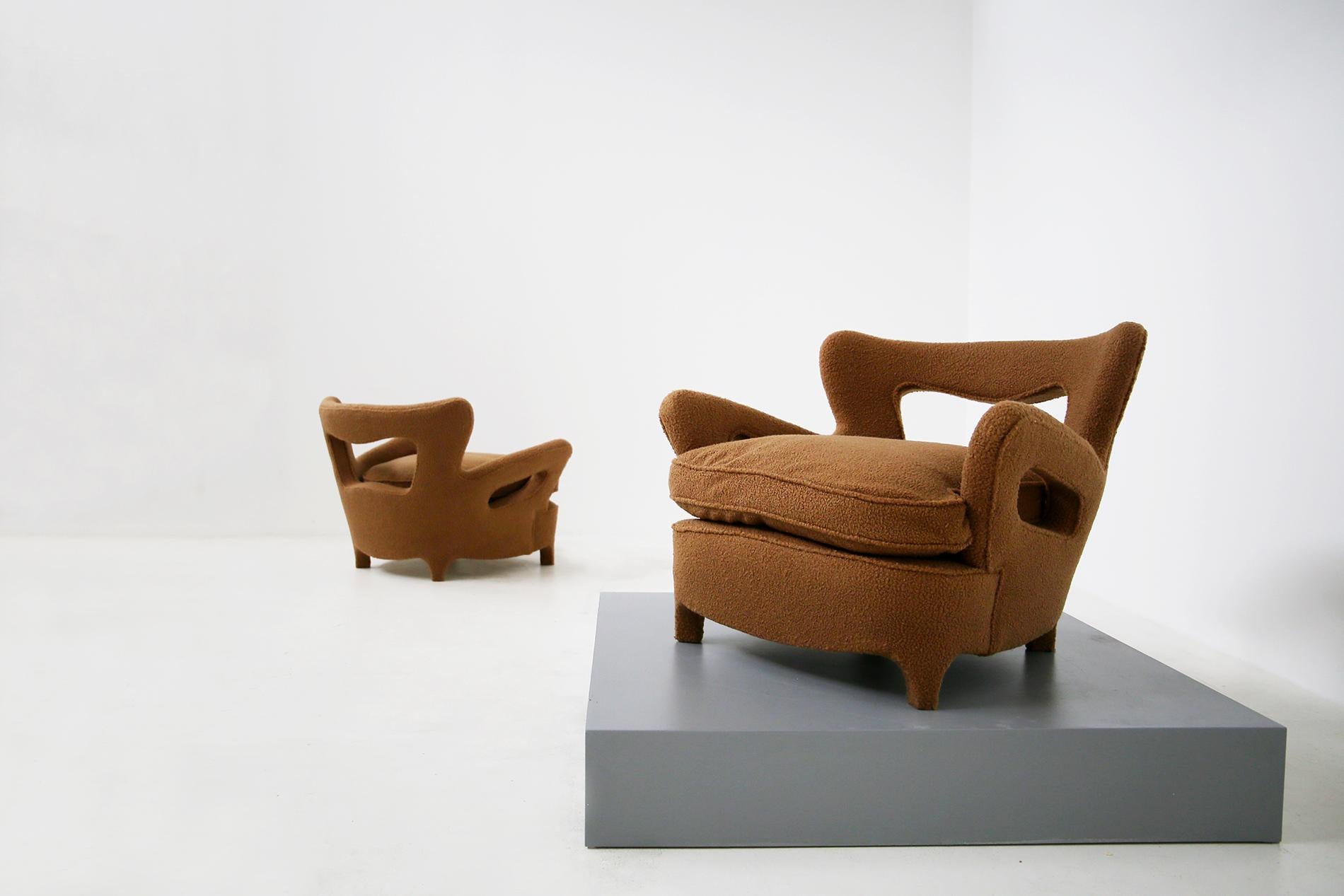 Rare pair of Italian armchairs by Carlo Enrico Rava from 1940. The armchairs have been restored in a beautiful bouclè fabric very fashionable in this period. The fabric is brown that gives the seat warmth and softness. The peculiarity of the