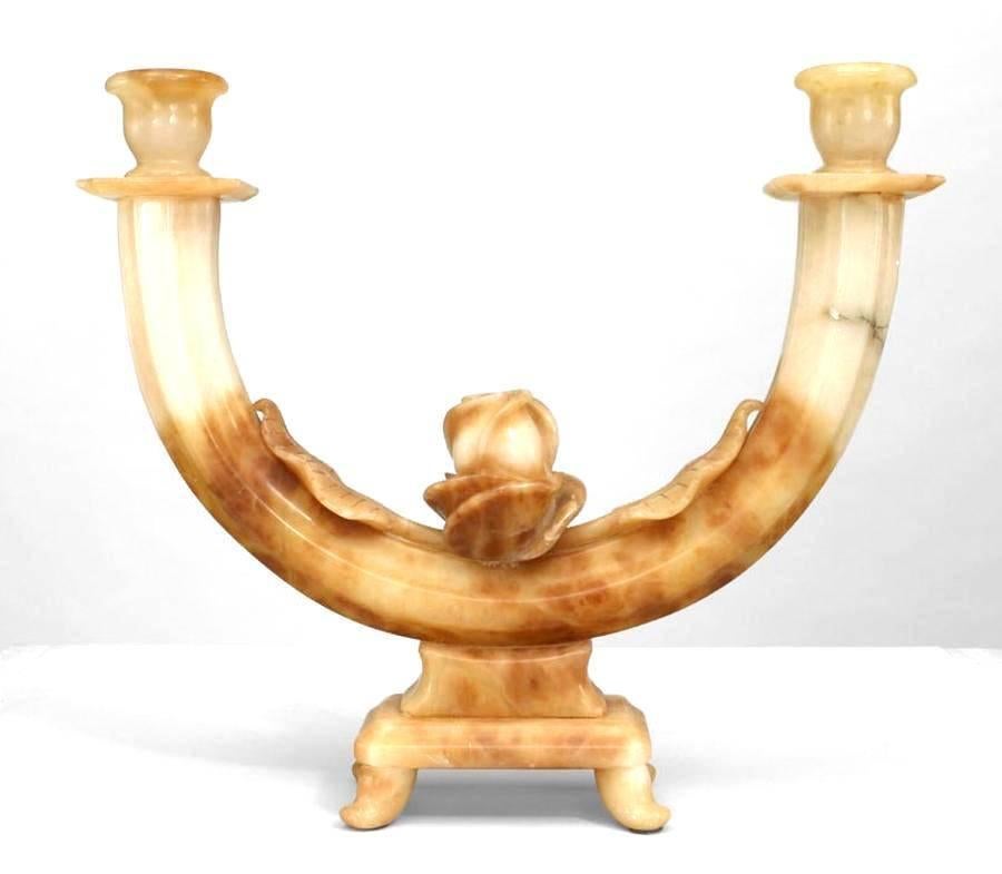 Pair of Italian Art Deco alabaster two-arm candelabra with floral carved center resting on a rectangular base (from VELLETRI, Italy).