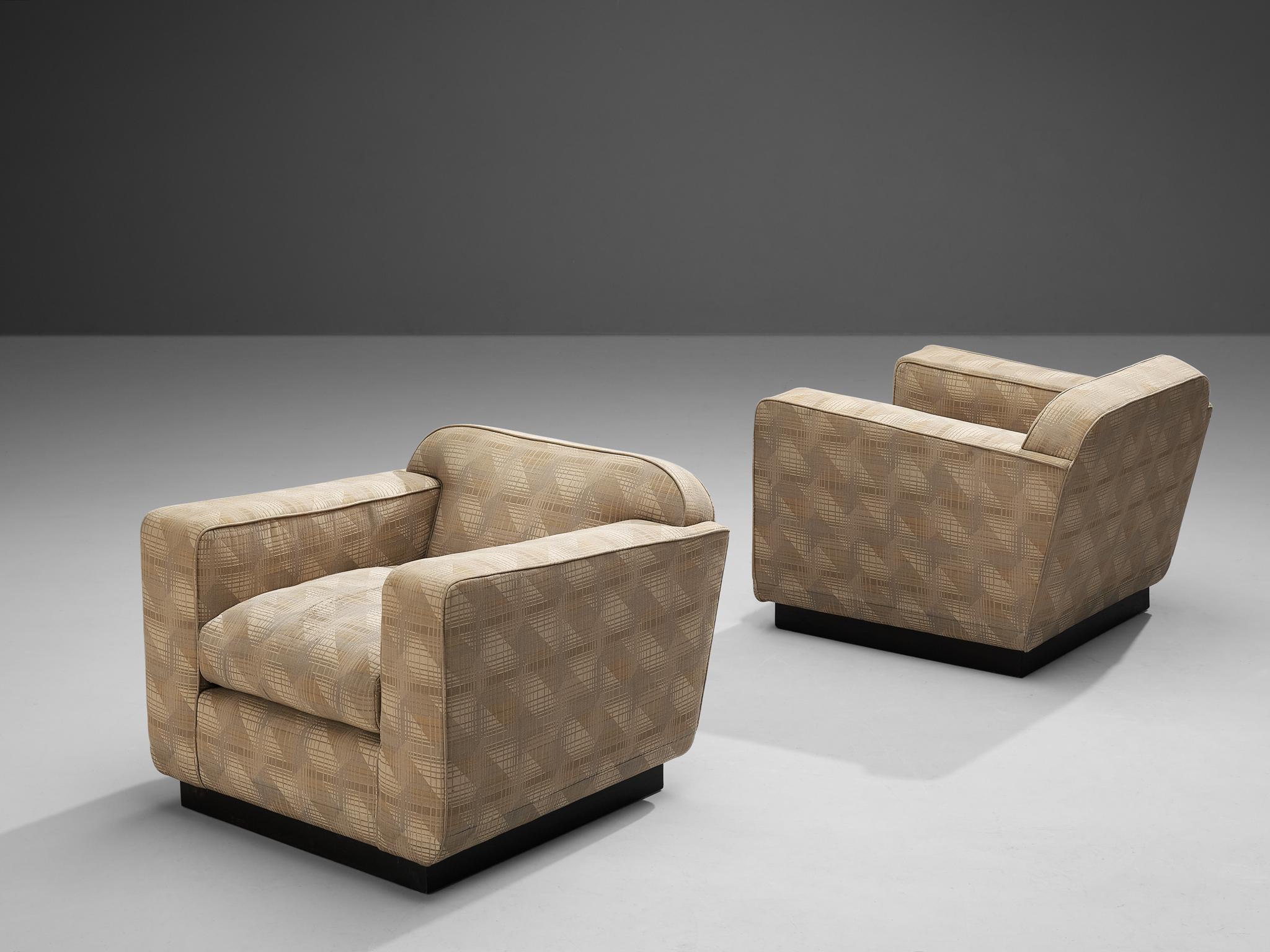 Pair of club chairs, fabric, lacquered wood, Italy, 1940s. 

Stunning pair of Art Deco armchairs with geometric patterned upholstery. Extraordinary chairs that, due to the combination of the abstract pattern and construction, allude to the Late