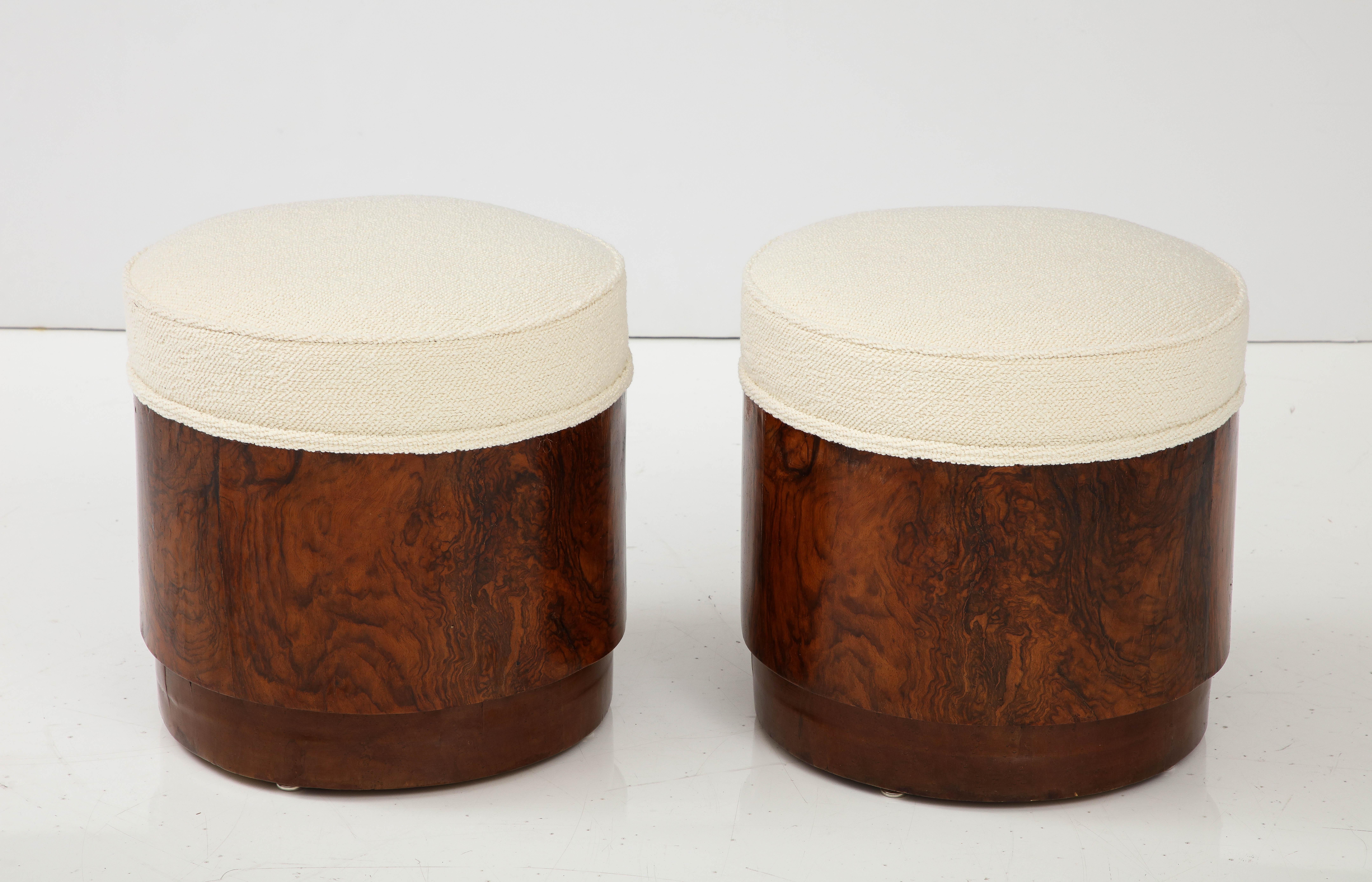 Pair of Italian Art Deco burl wood circular stools, the beautiful rich wood contrasts nicely with the newly upholstered seats in European cream textured cotton.  The base  with an elegantly tapered form. 
Italy circa 1940 
Size: 15