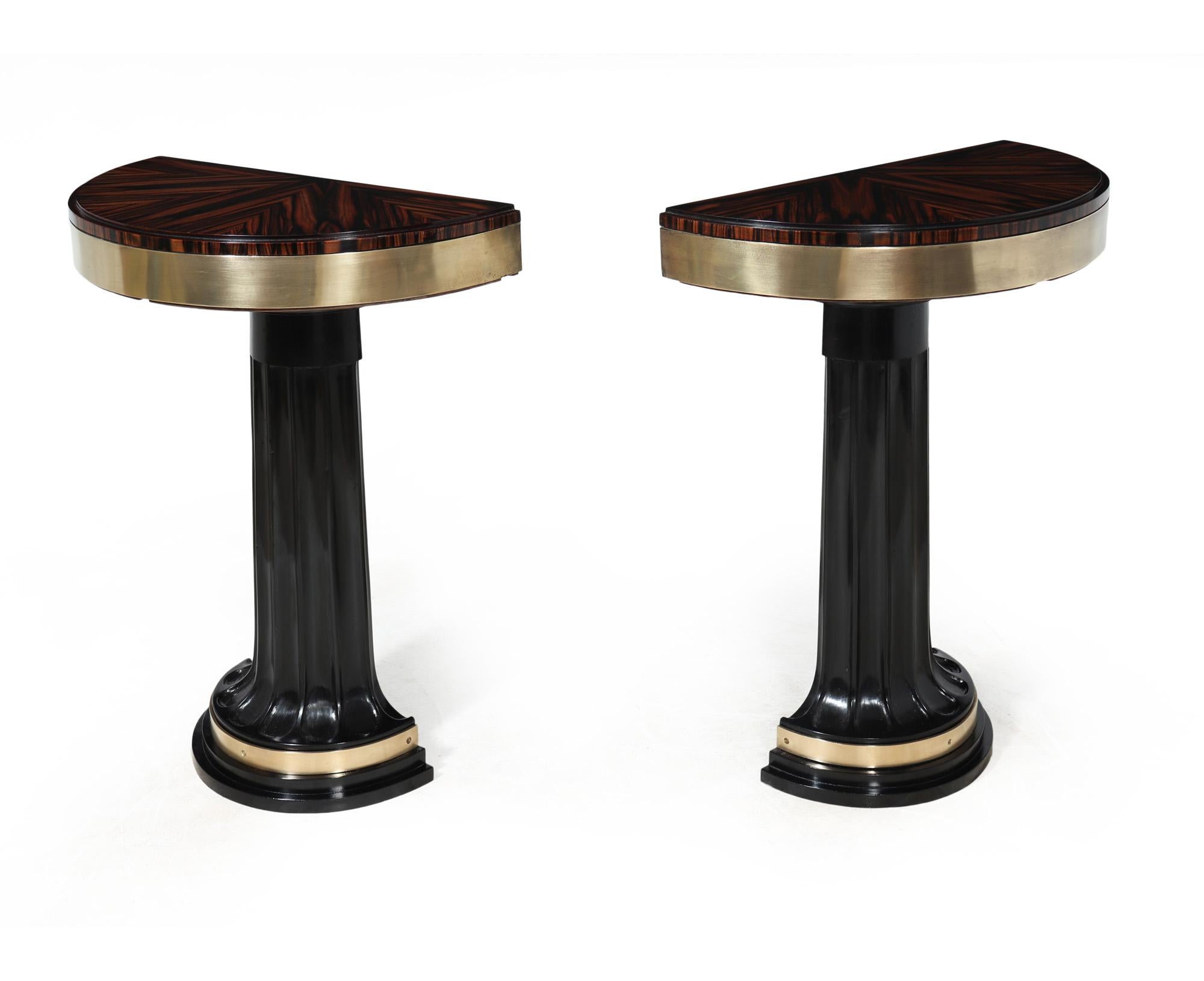 ITALIAN ART DECO CONSOLE TABLES
A stunning little pair of Italian Art Deco console tables with Macassar Ebony tops and have brass surround with a Demi lune ebonised and fluted upright that gently curves onto more brass work and steeped down base.