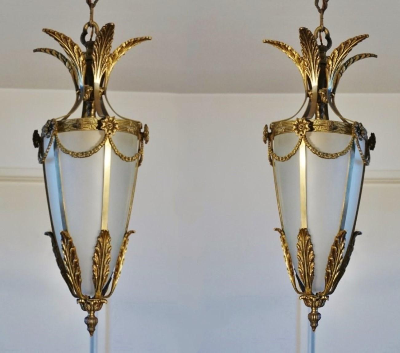 Pair of Art Deco lanterns, Italy, 1930s. Solid bronze and parcel brass with cone-shaped frosted glass shade.
Each lantern: One E27 brass and porcelain light socket for a large sized bulb up to 60W-100W.
Dimensions:
Total height with chain 41
