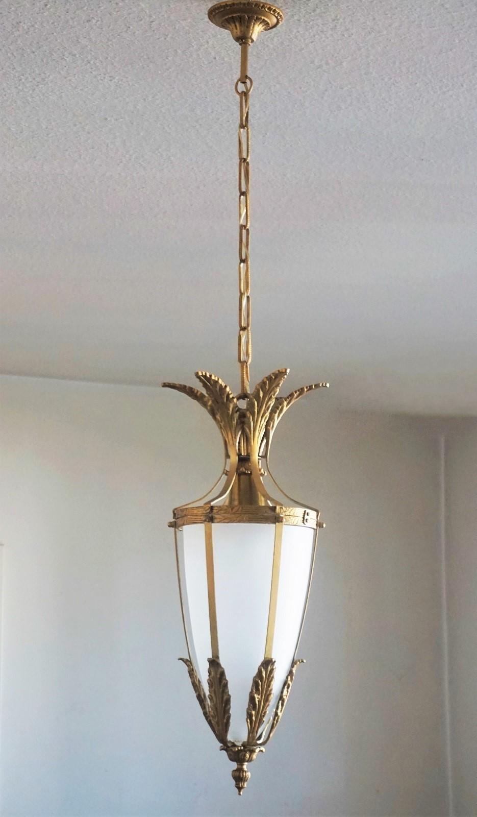 Pair of beautiful and elegant Art Deco lanterns, Italy, 1930-1939. Solid bronze parcel brass with cone shaped satin glass shade.
Each lantern takes one E27 large sized bulb up to 100watt.
Dimensions:
Total height with chain 39