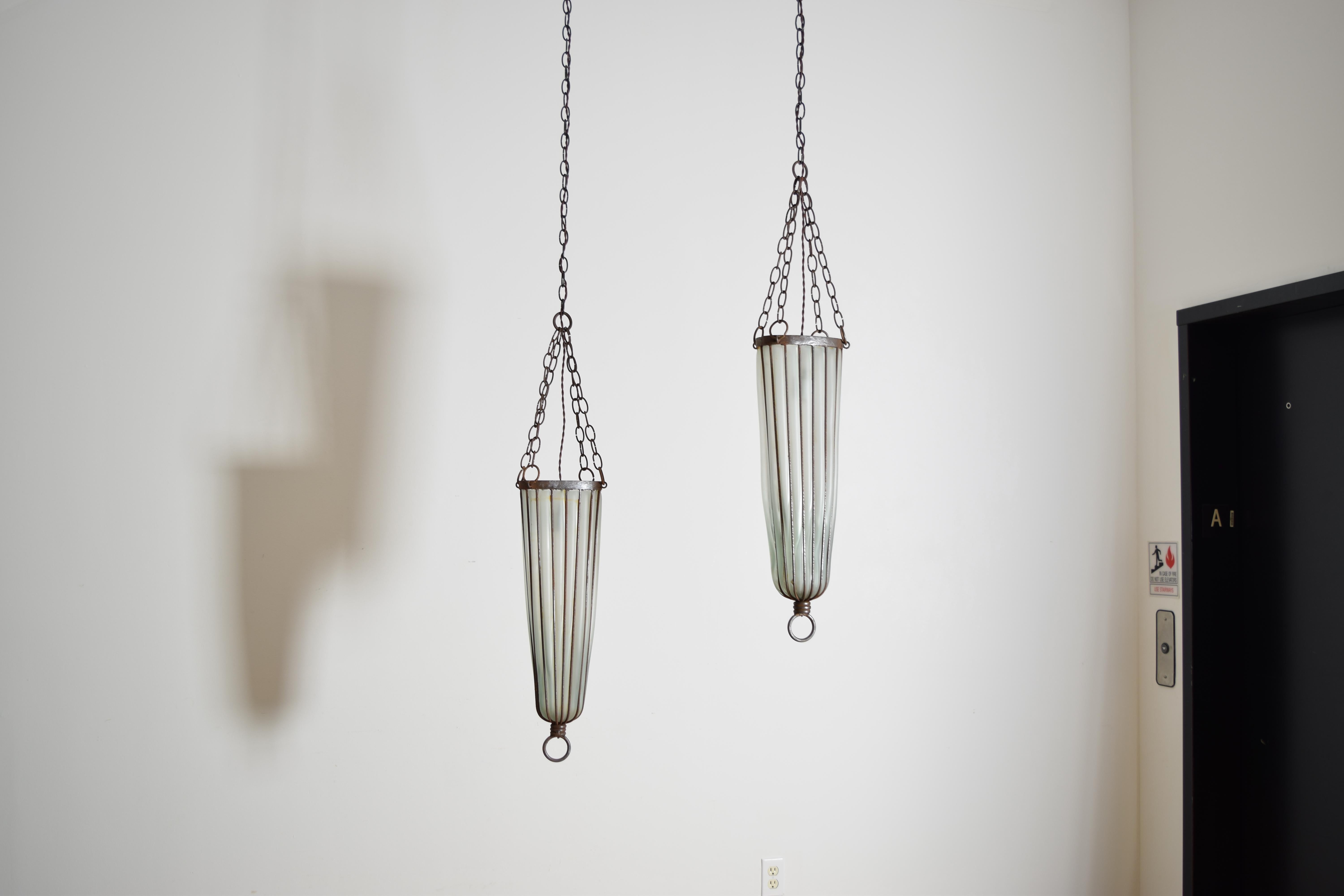 Murano Blown Glass within Hand Wrought Iron Vessels

Height: 39
