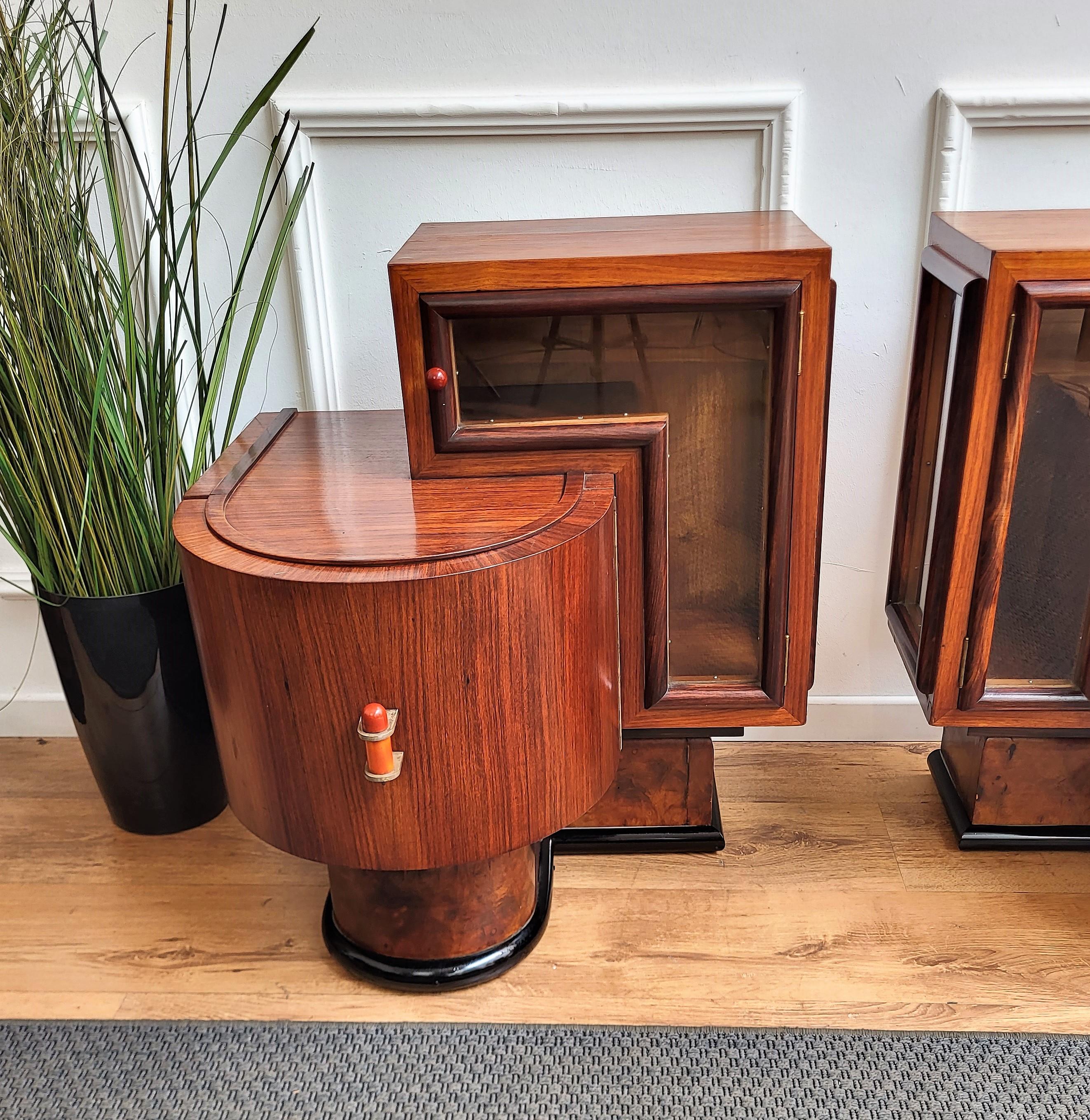 Very important, elegant and refined pair of Italian 1940s Art Deco bedside tables with great design shape of the glass geometric side door and the curved front door with the bold handles all in typical Art Deco style. This night stands make a great