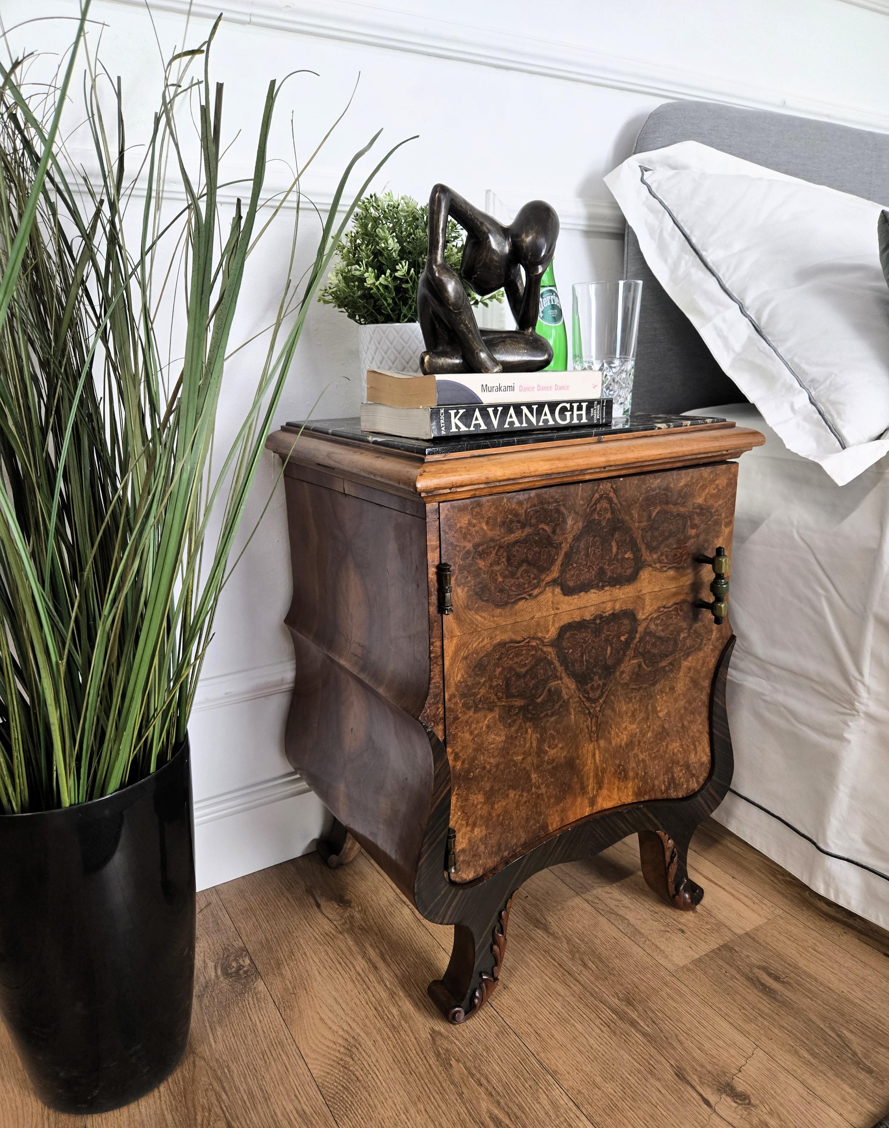 Very elegant and refined pair of Italian 1940s Art Deco bedside tables with great design shape and decors in veneer burl walnut briar wood and carved door with black Portoro marble top. Portoro is a high-quality black marble, where the vast
